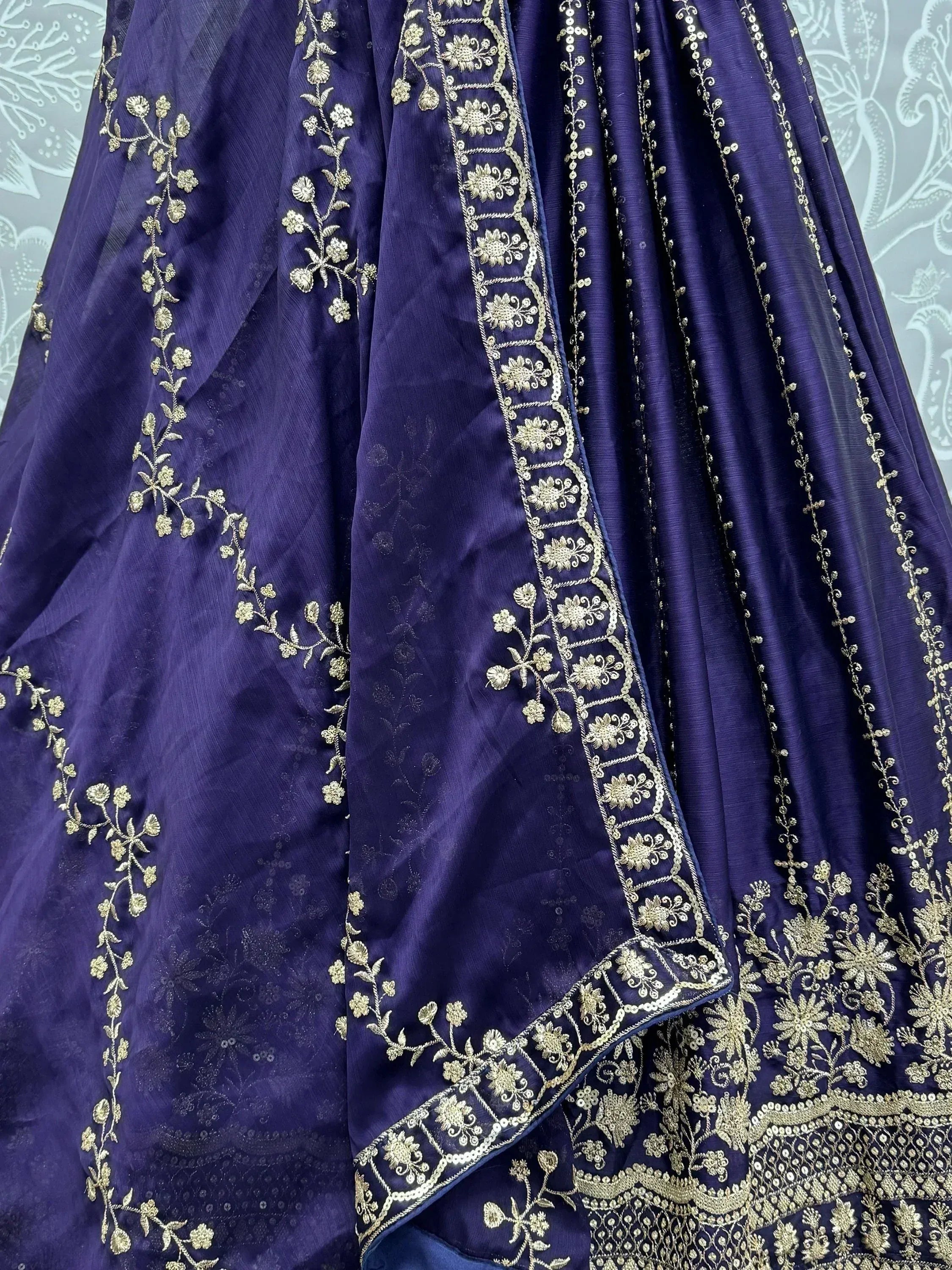 Purple ethnic gown with gold floral embroidery and intricate detailing