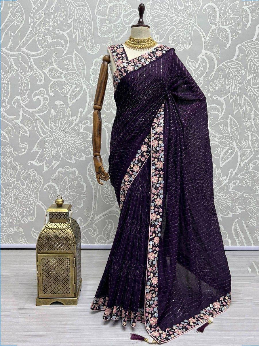 Purple floral embroidered saree with sequin detailing, styled on mannequin for ethnic wear