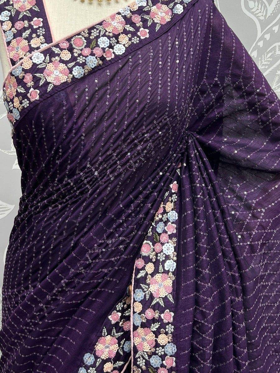 Purple saree with floral embroidery and sequin detailing, ideal for ethnic occasions