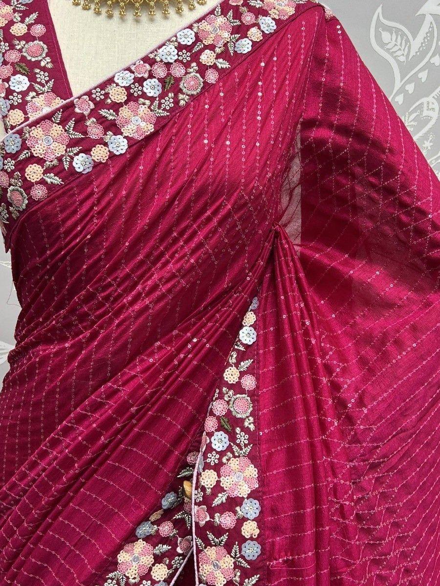 Rich maroon saree with floral embroidery and sequin detailing, perfect for ethnic occasions