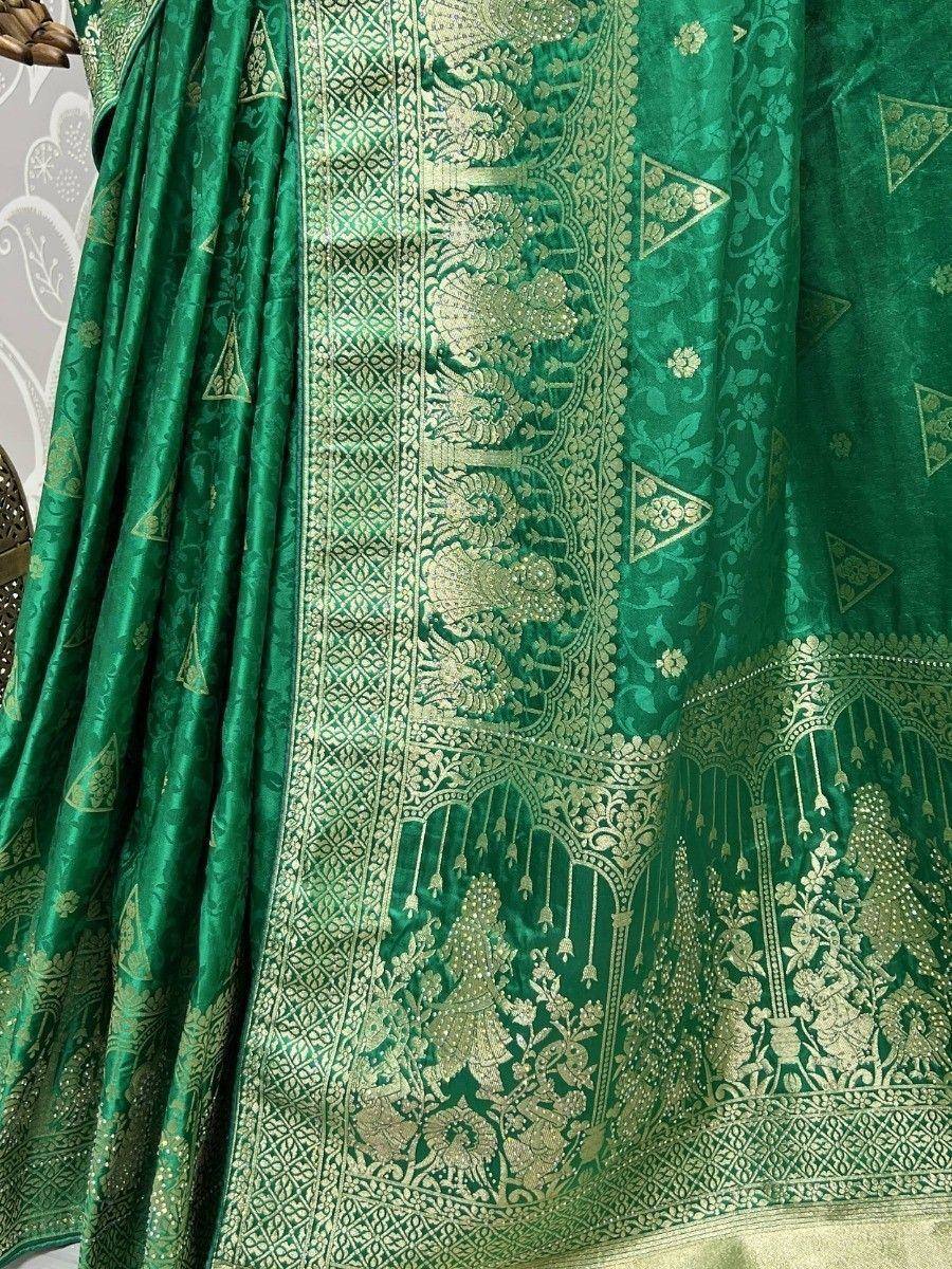 Emerald green designer lehenga with intricate gold zari embroidery and traditional motifs