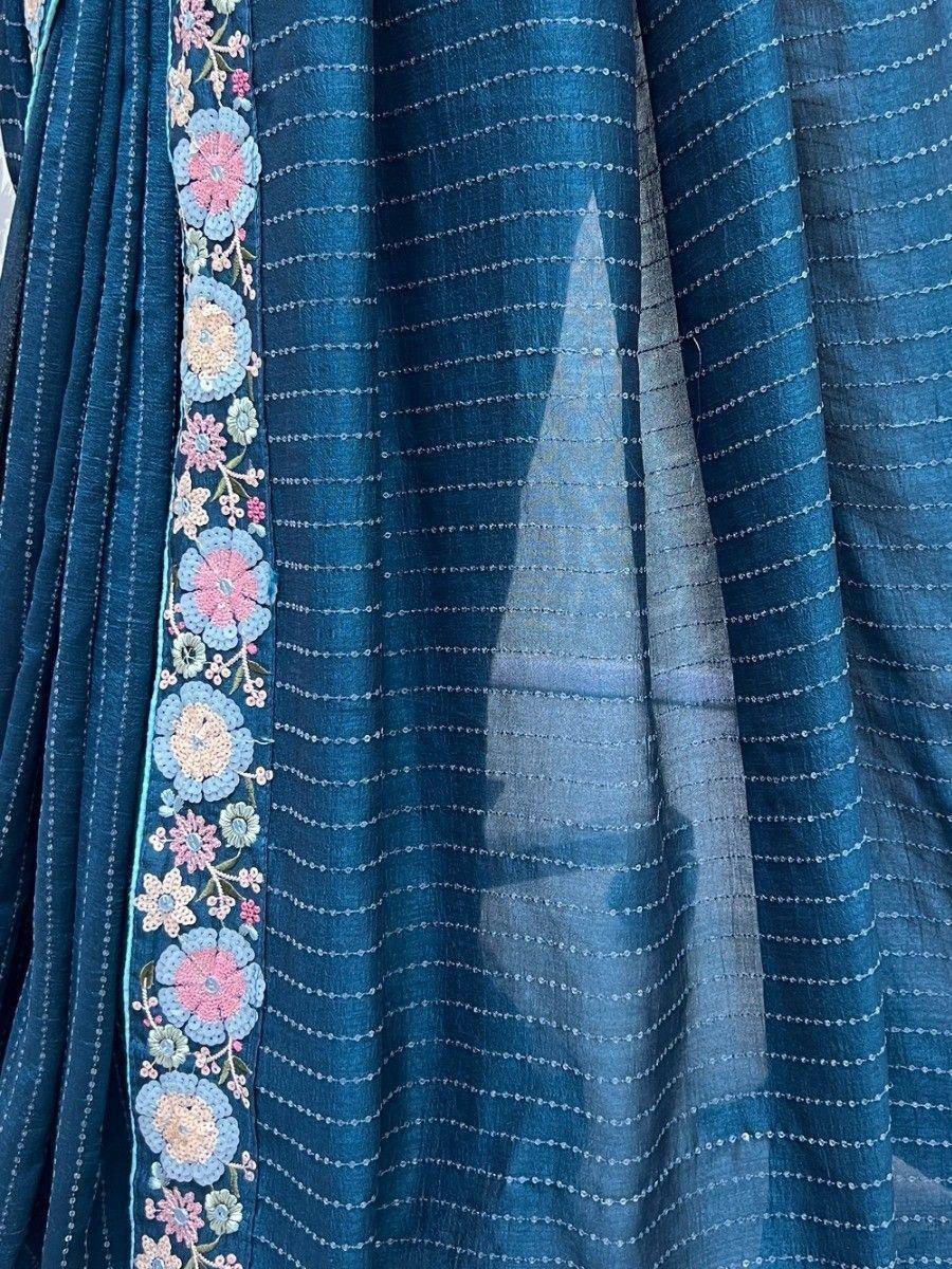 Blue ethnic gown with floral embroidery and dotted stripes, perfect for Indian wear