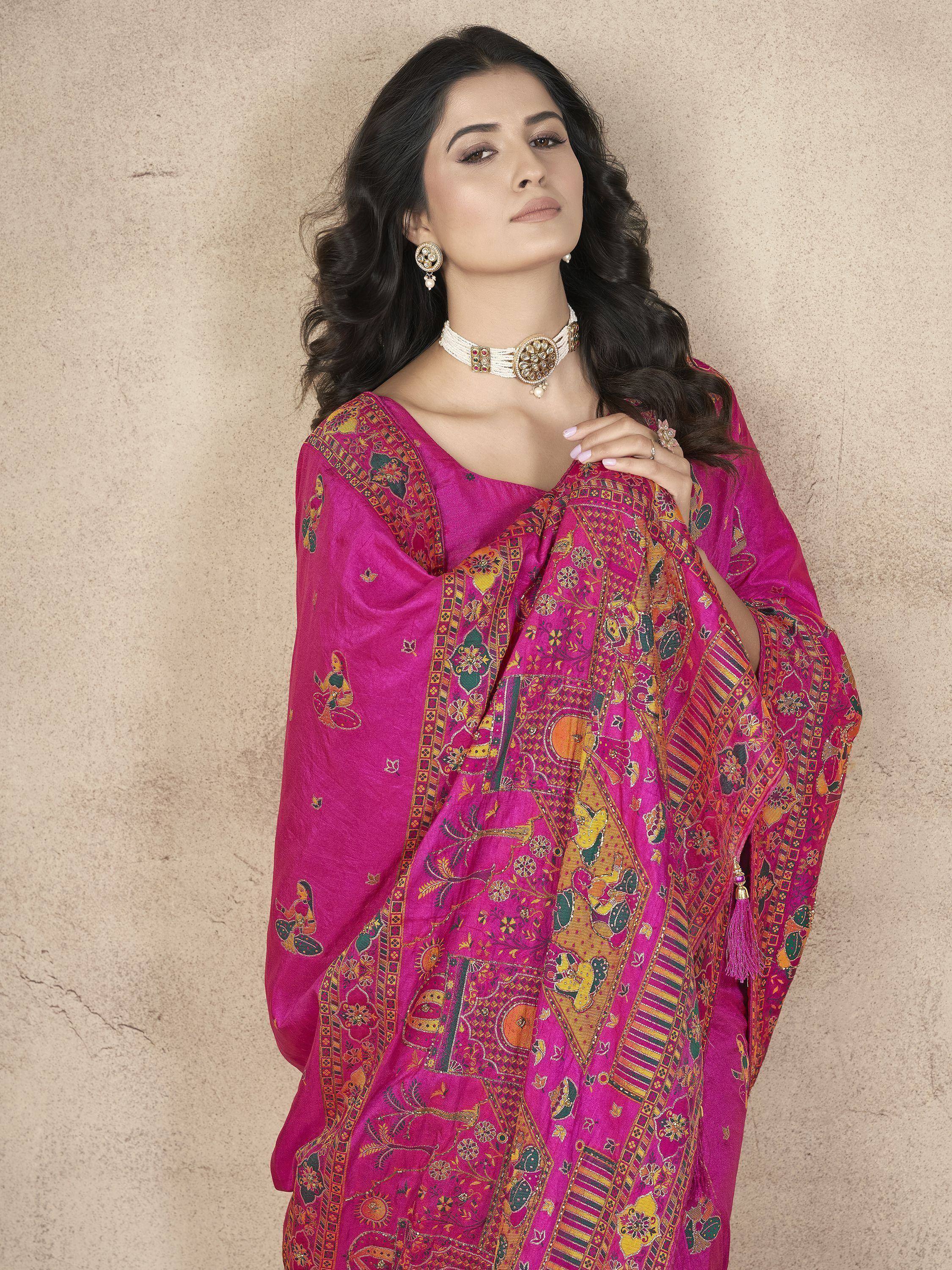 Woman in vibrant pink printed salwar kameez with ethnic jewelry, perfect for Indian festive occasions