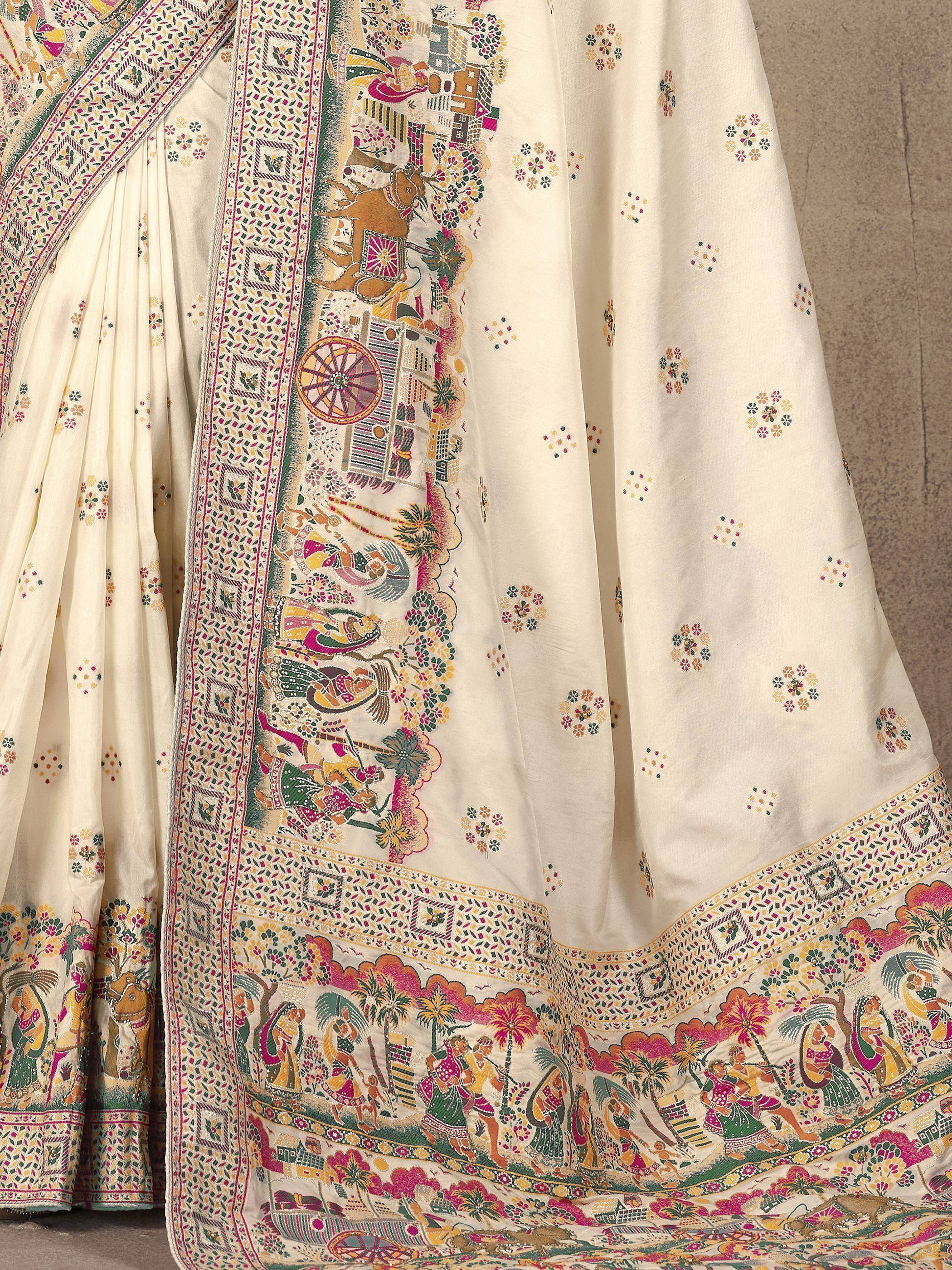 Cream saree with vibrant folk art print, floral motifs, and detailed border for ethnic wear