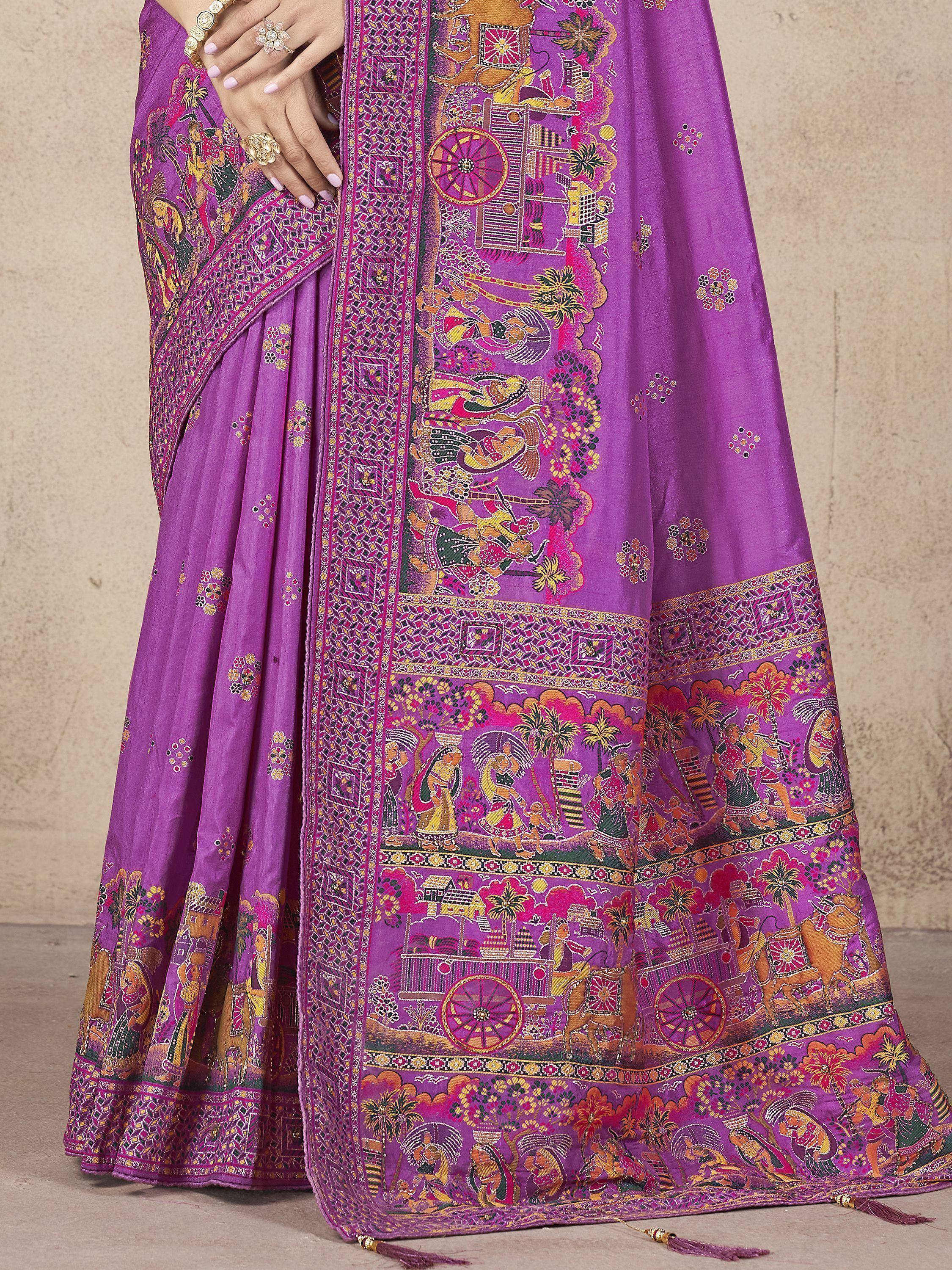 Purple Indian saree with intricate folk art print, traditional embroidery, and vibrant border details