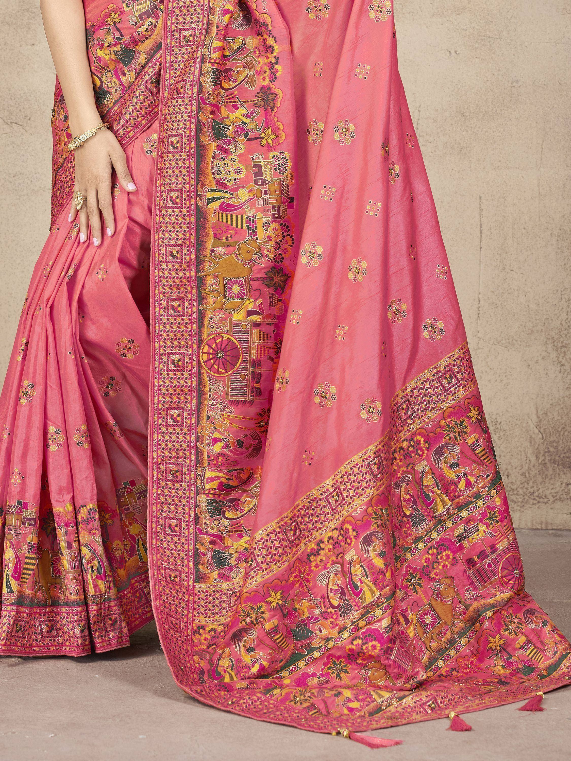 Pink designer saree with intricate ethnic print and golden motifs, perfect for festive occasions