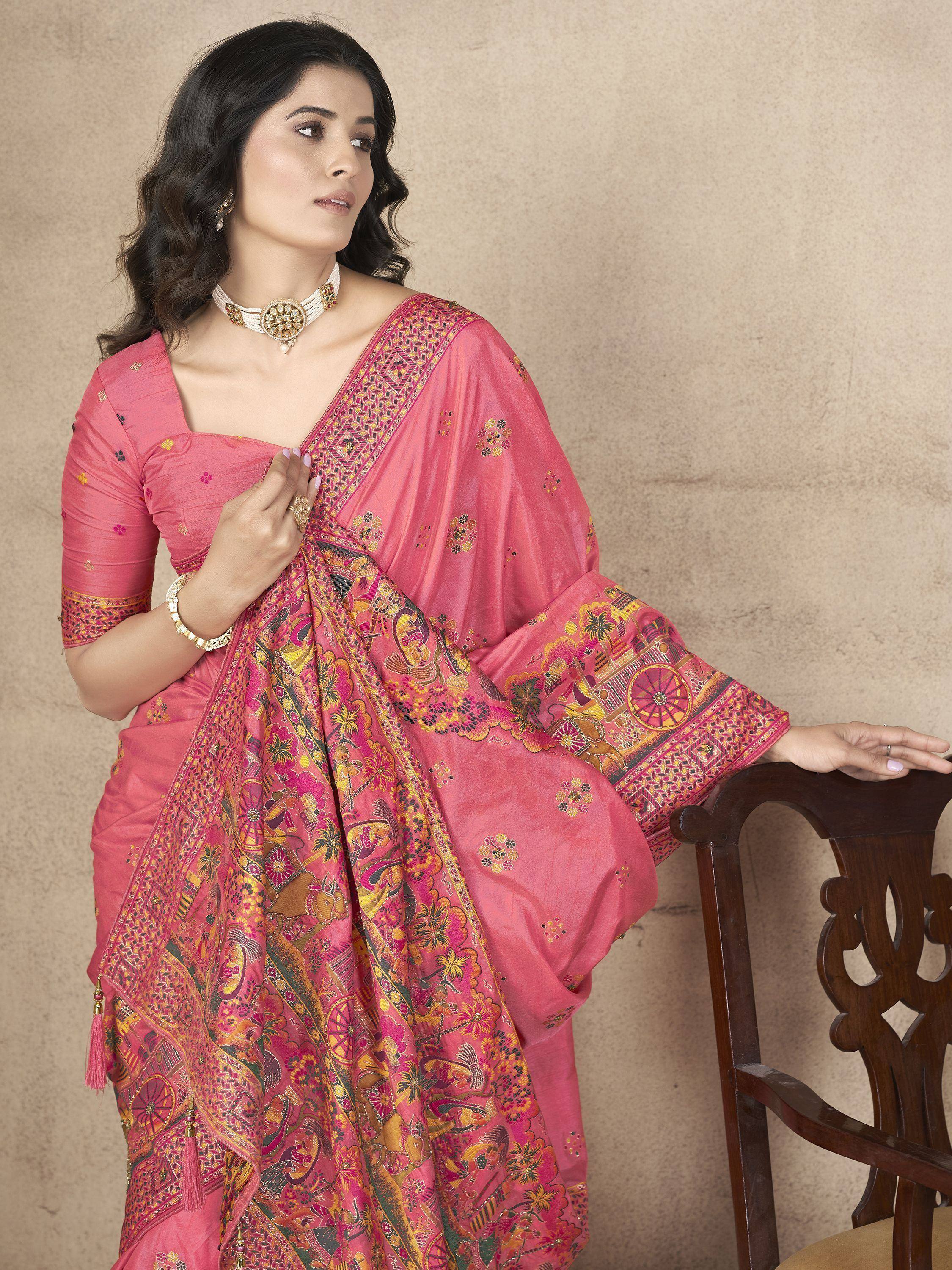 Pink printed saree with ethnic motifs, perfect for Indian festive occasions and traditional wear