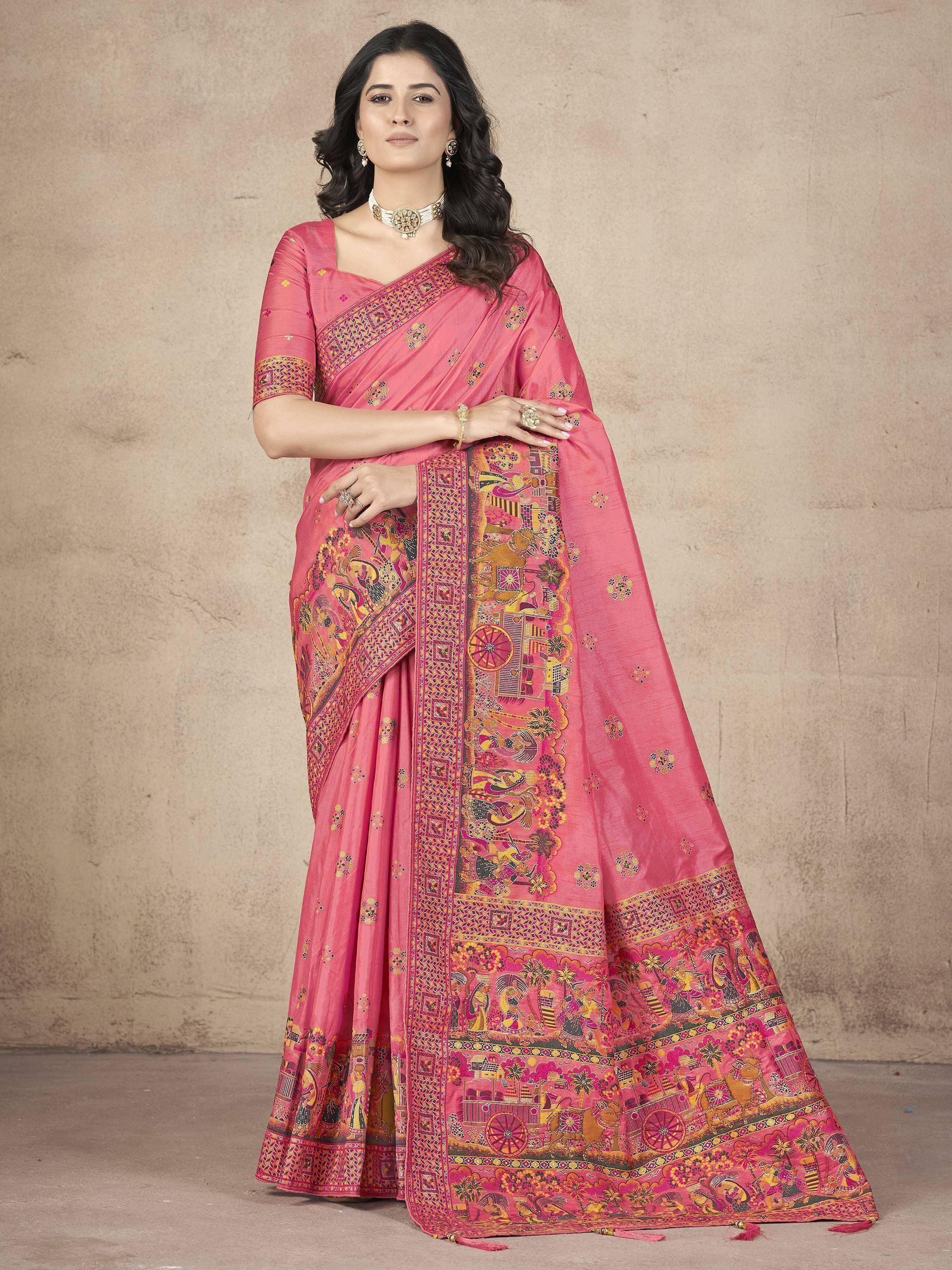 Pink ethnic saree with intricate printed motifs and border, paired with matching blouse for traditional Indian wear