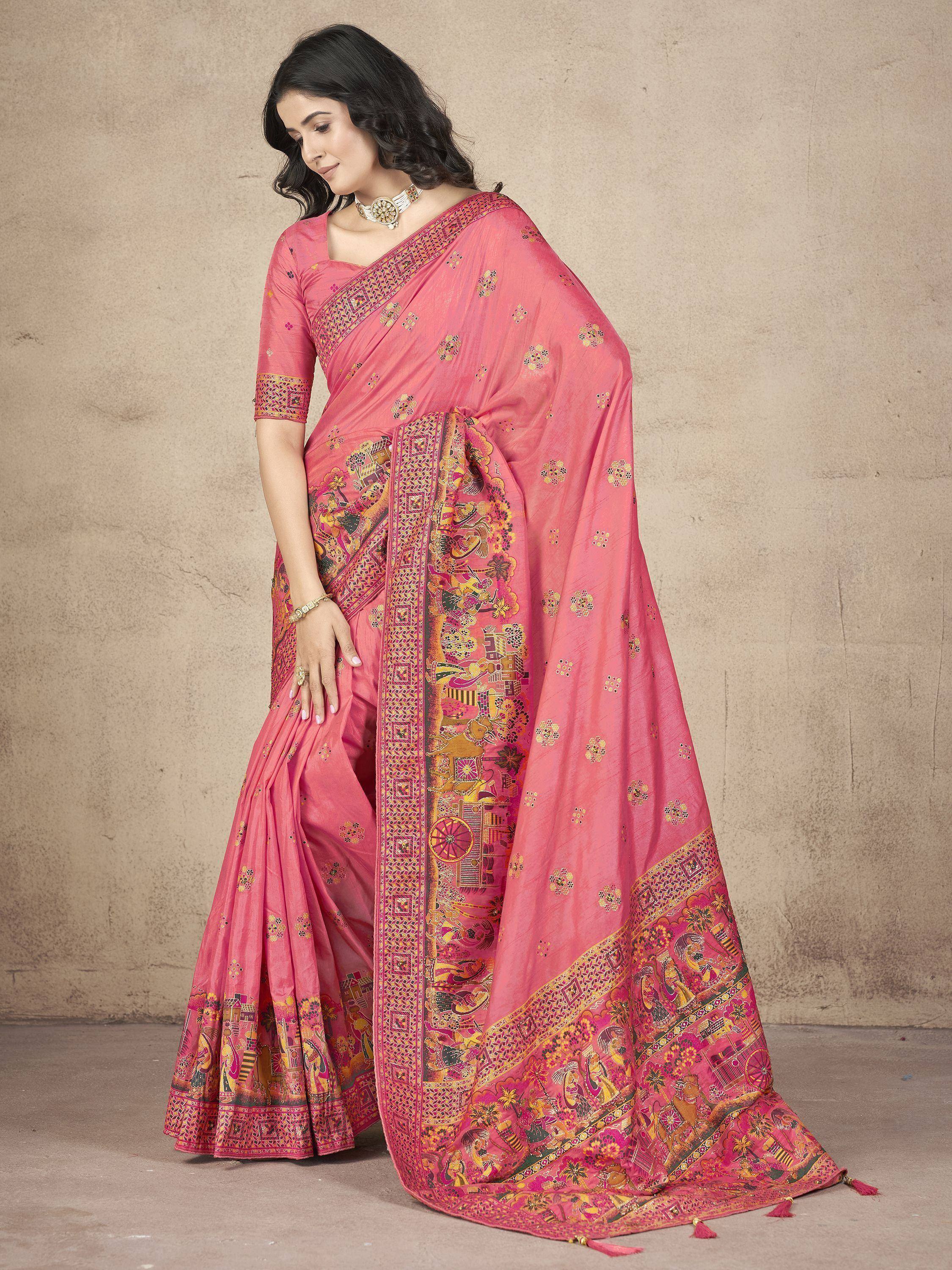 Pink printed saree with intricate border, perfect for Indian ethnic wear and festive occasions.