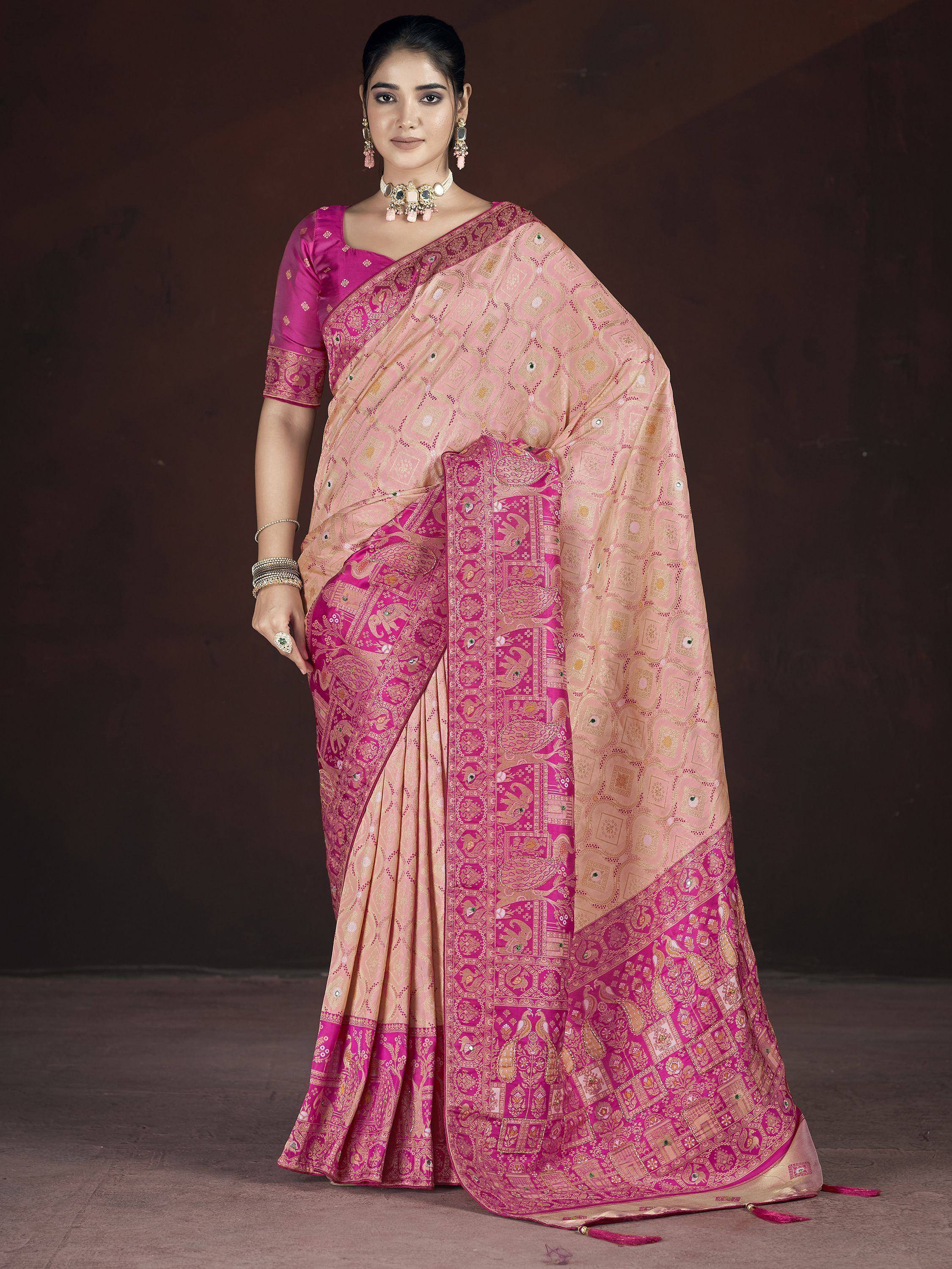 Pink and beige designer saree with elephant motifs and gold zari work, perfect for Indian ethnic occasions