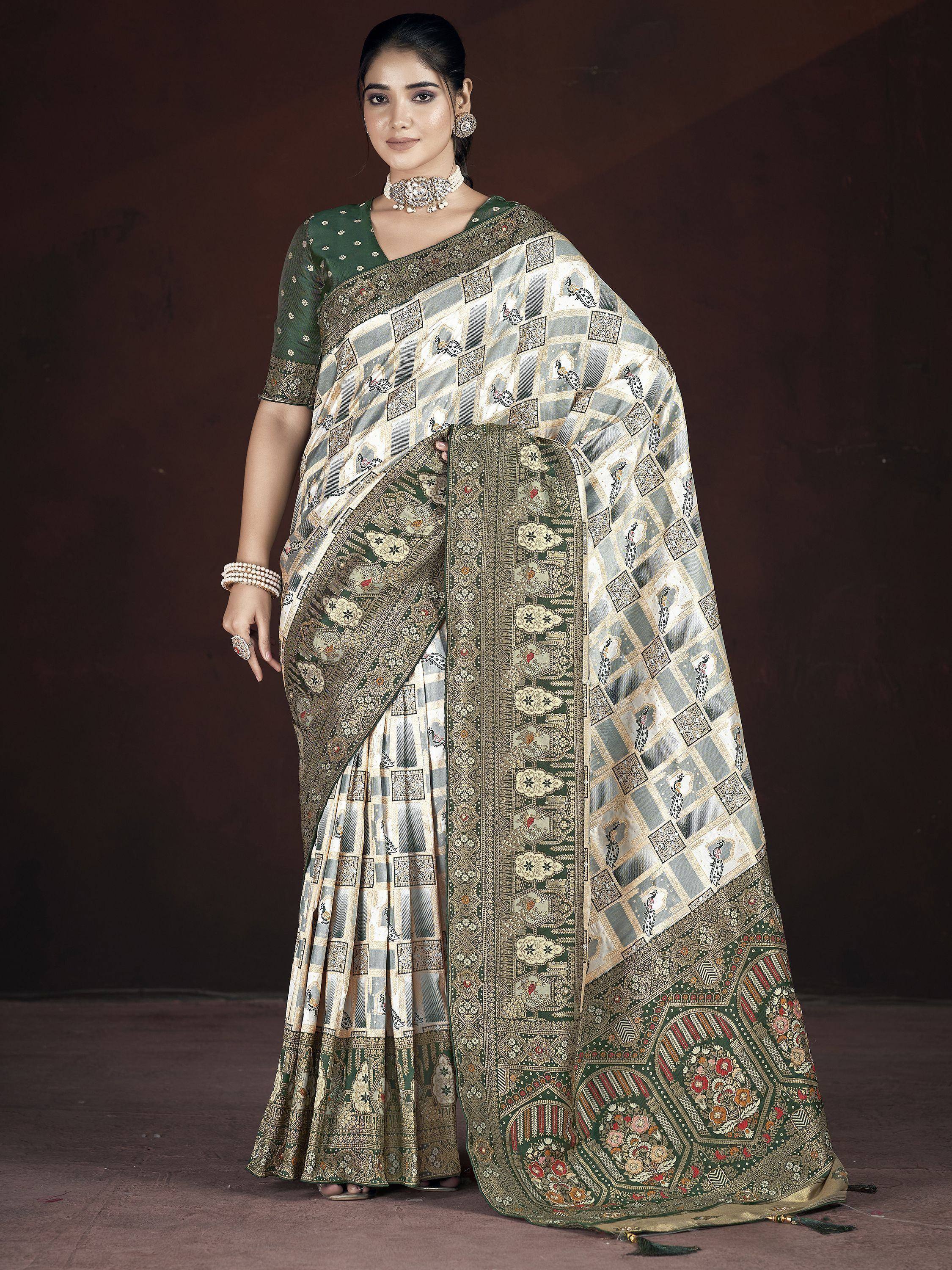 Elegant green and cream saree with peacock print and gold border, paired with matching blouse for Indian ethnic wear.