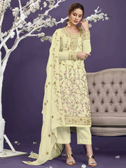 Woman in cream floral embroidered salwar kameez with dupatta, posing indoors on Ethnic Plus.