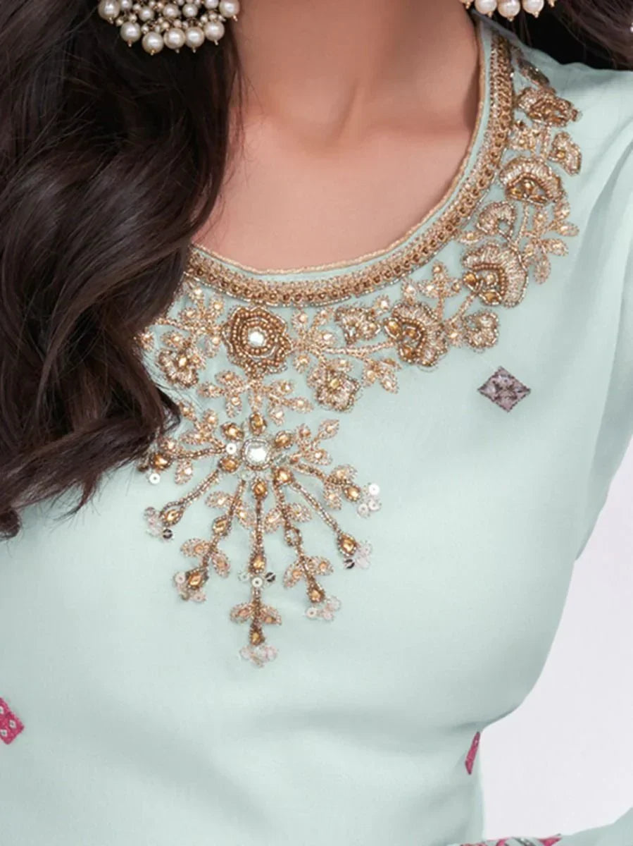 Light blue ethnic dress with gold sequin embroidery and floral neckline detailing