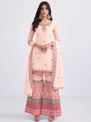 Woman in light peach embroidered Indian salwar kameez set with dupatta, Ethnic Plus