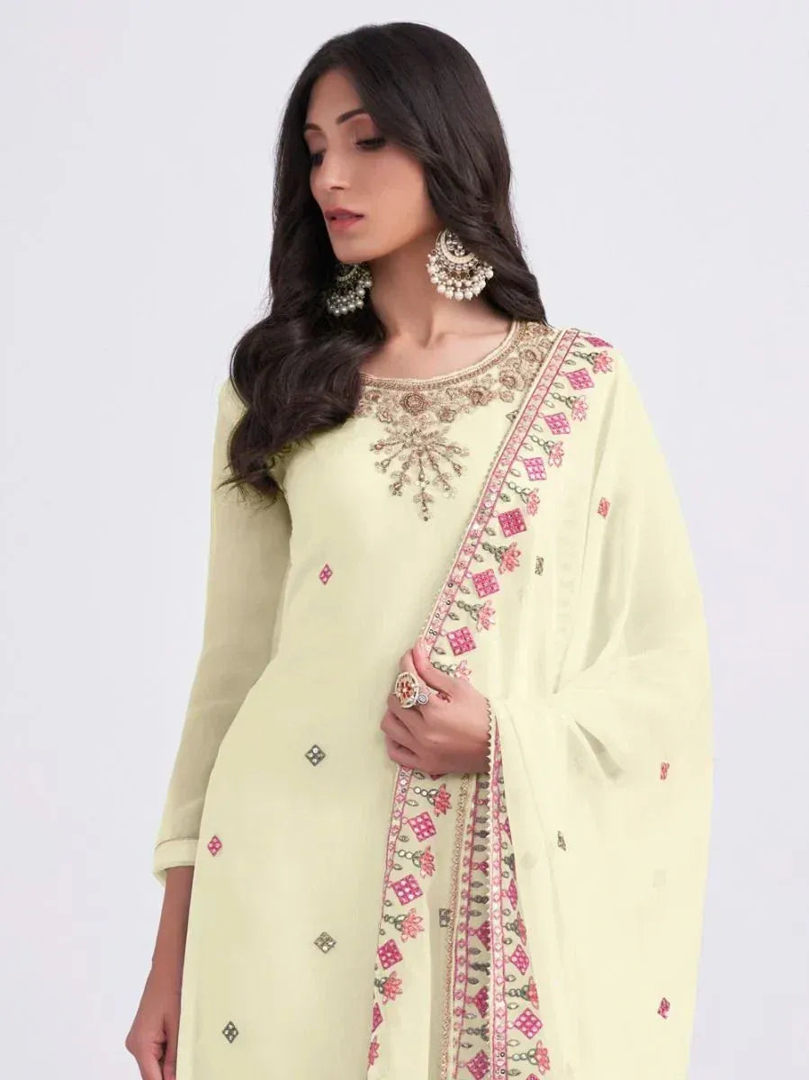 Light green embroidered salwar kameez with pink floral dupatta, perfect for ethnic occasions