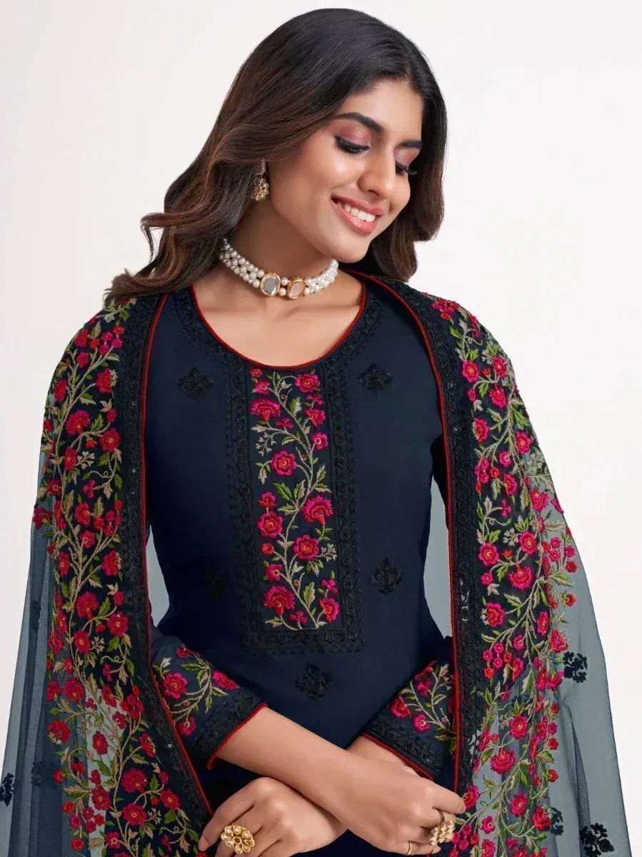 Elegant navy blue embroidered salwar kameez with floral dupatta, perfect for Indian ethnic wear occasions.