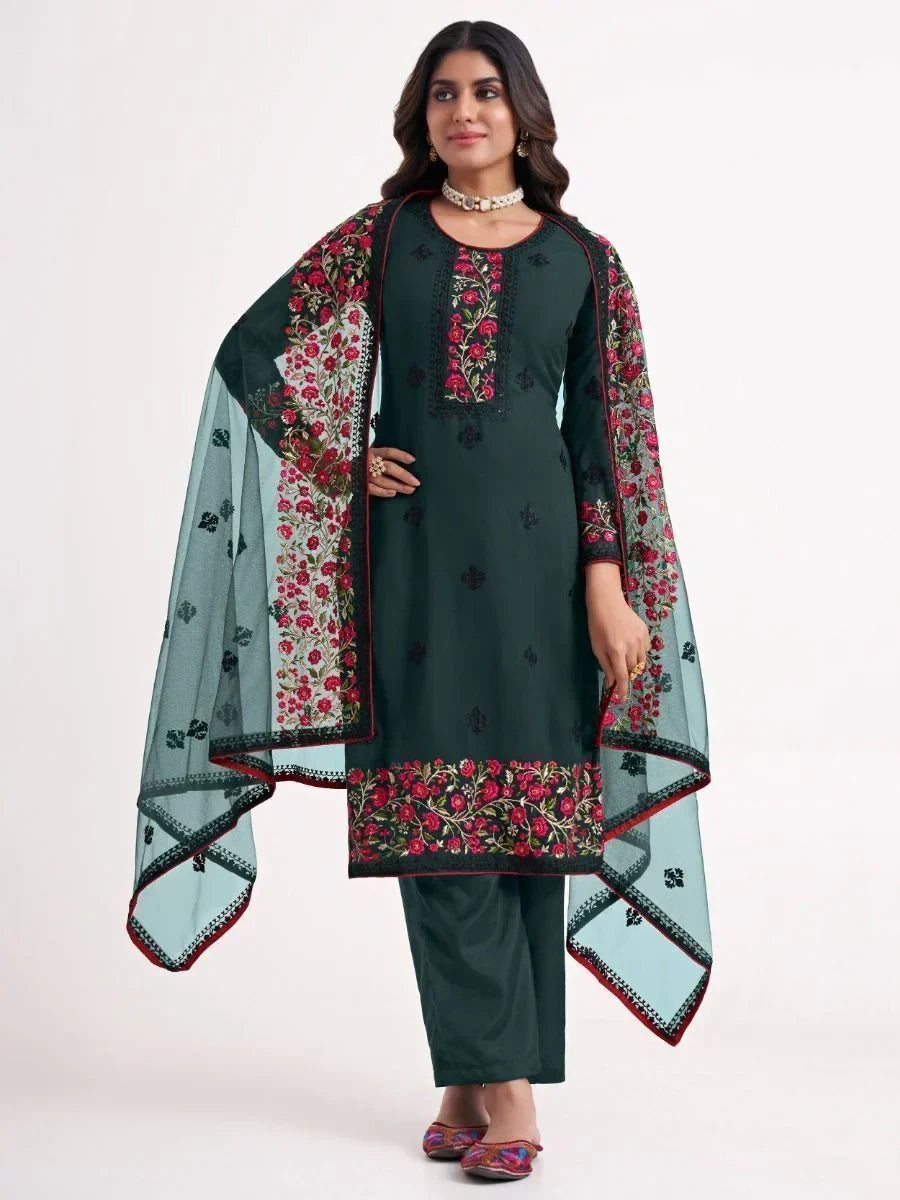 Woman wearing dark green embroidered salwar kameez with floral dupatta, ethnic wear
