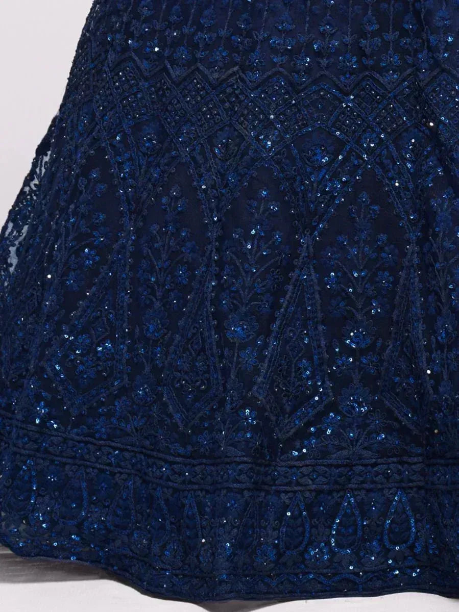 Navy blue ethnic gown with intricate sequin and floral embroidery, perfect for festive occasions.