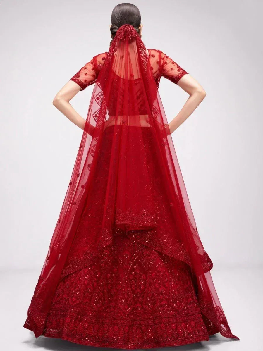 Red designer lehenga choli with sheer dupatta, intricate embroidery, and sequin detailing for Indian weddings