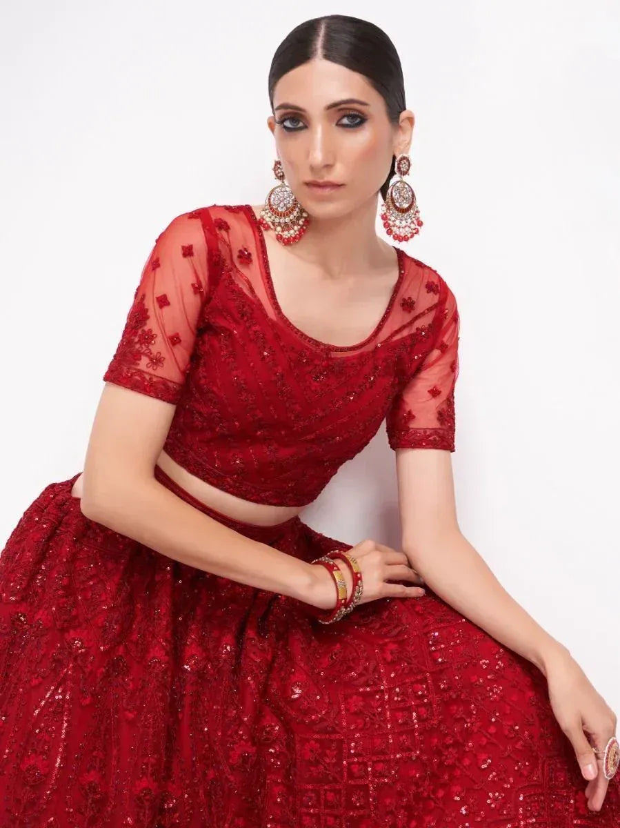 Red embroidered lehenga choli with sheer sleeves, perfect for Indian weddings and festive occasions