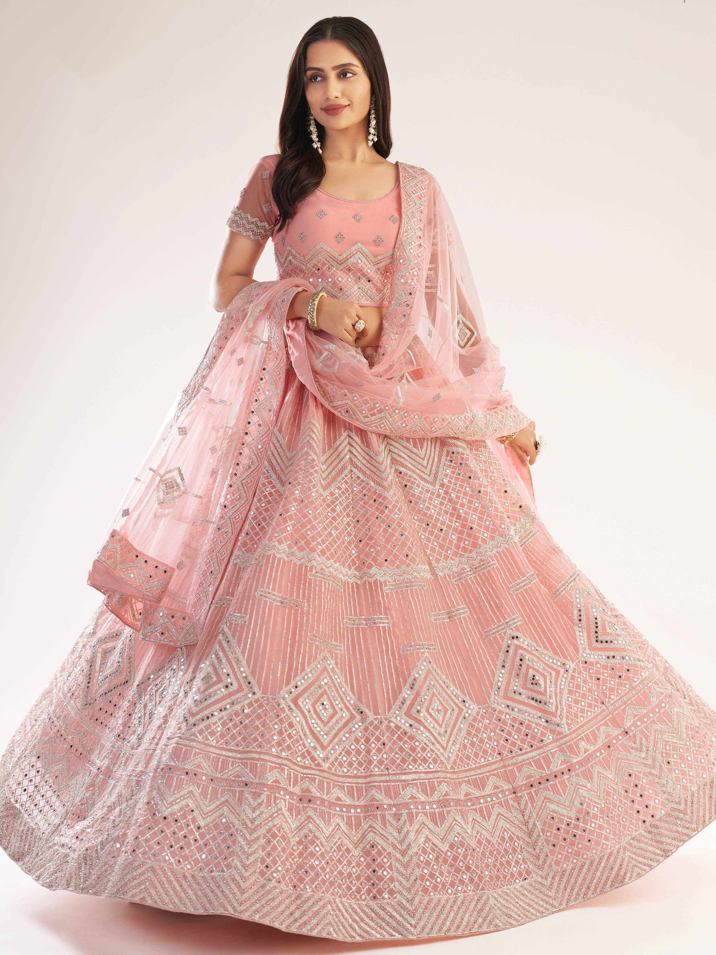 Pink designer lehenga choli with intricate mirror and thread work, perfect for Indian ethnic wear occasions