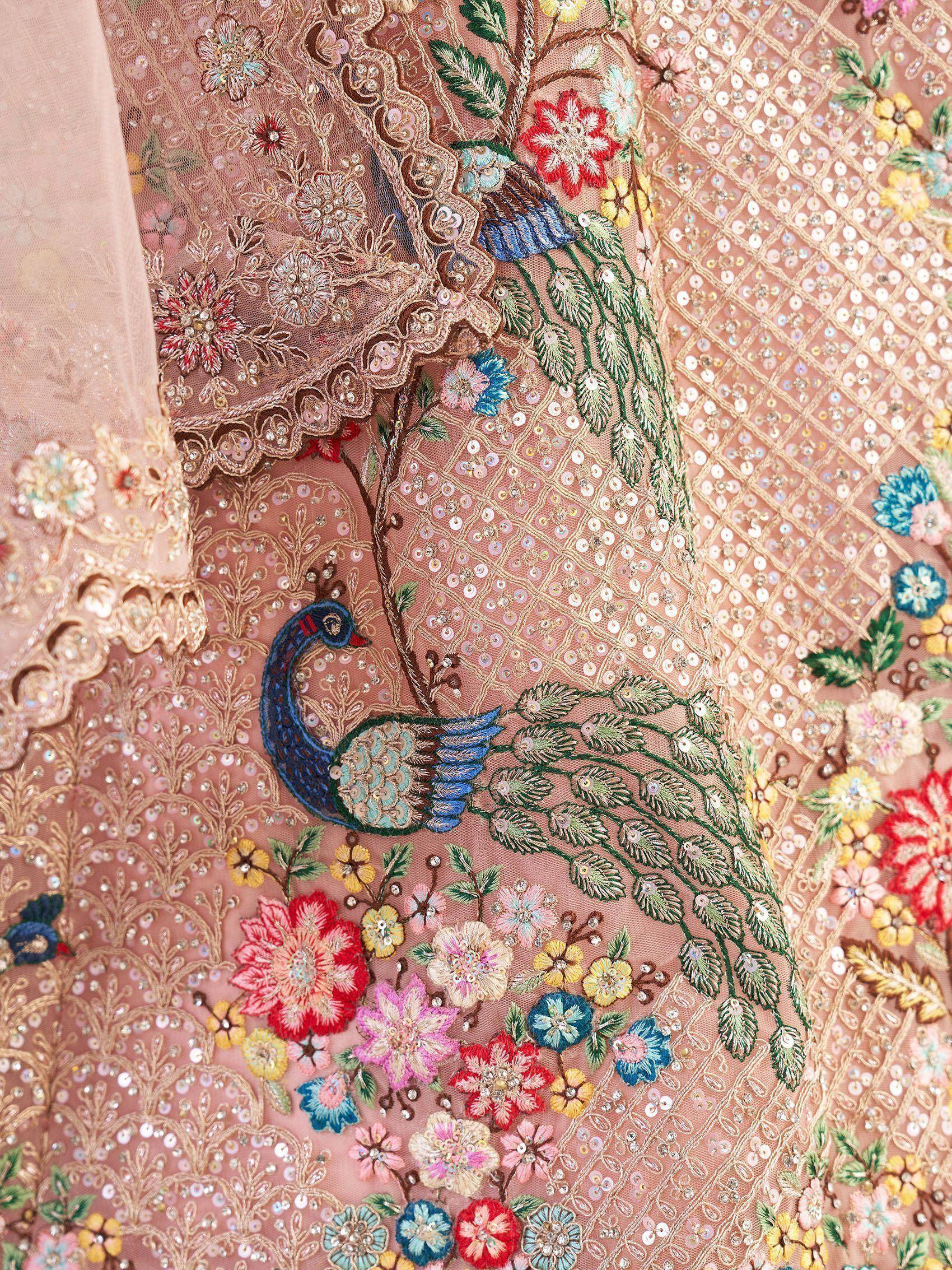Pink ethnic gown with peacock and floral embroidery, sequins, and lace detailing for festive wear