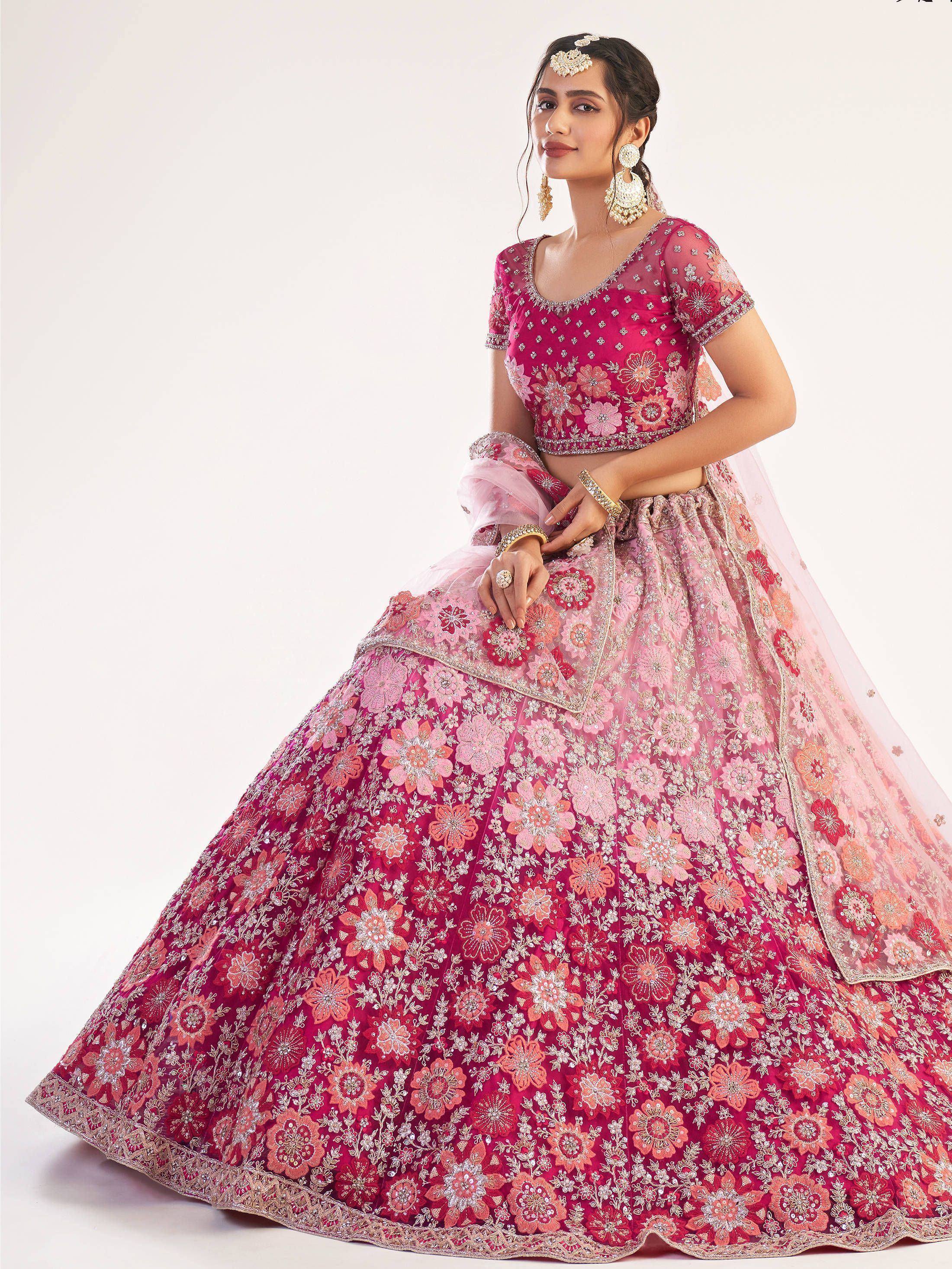 Pink and red floral embroidered lehenga choli with sheer dupatta, perfect for Indian weddings and festive occasions.