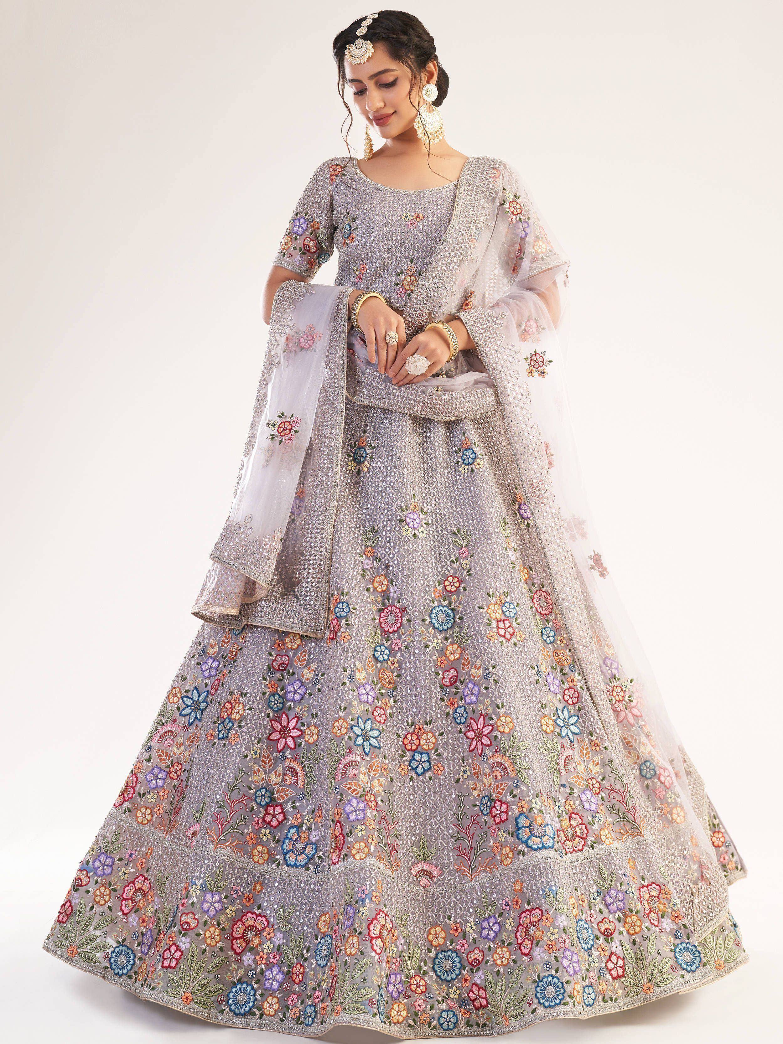 Elegant lavender lehenga choli with floral embroidery, perfect for Indian weddings and festive occasions.