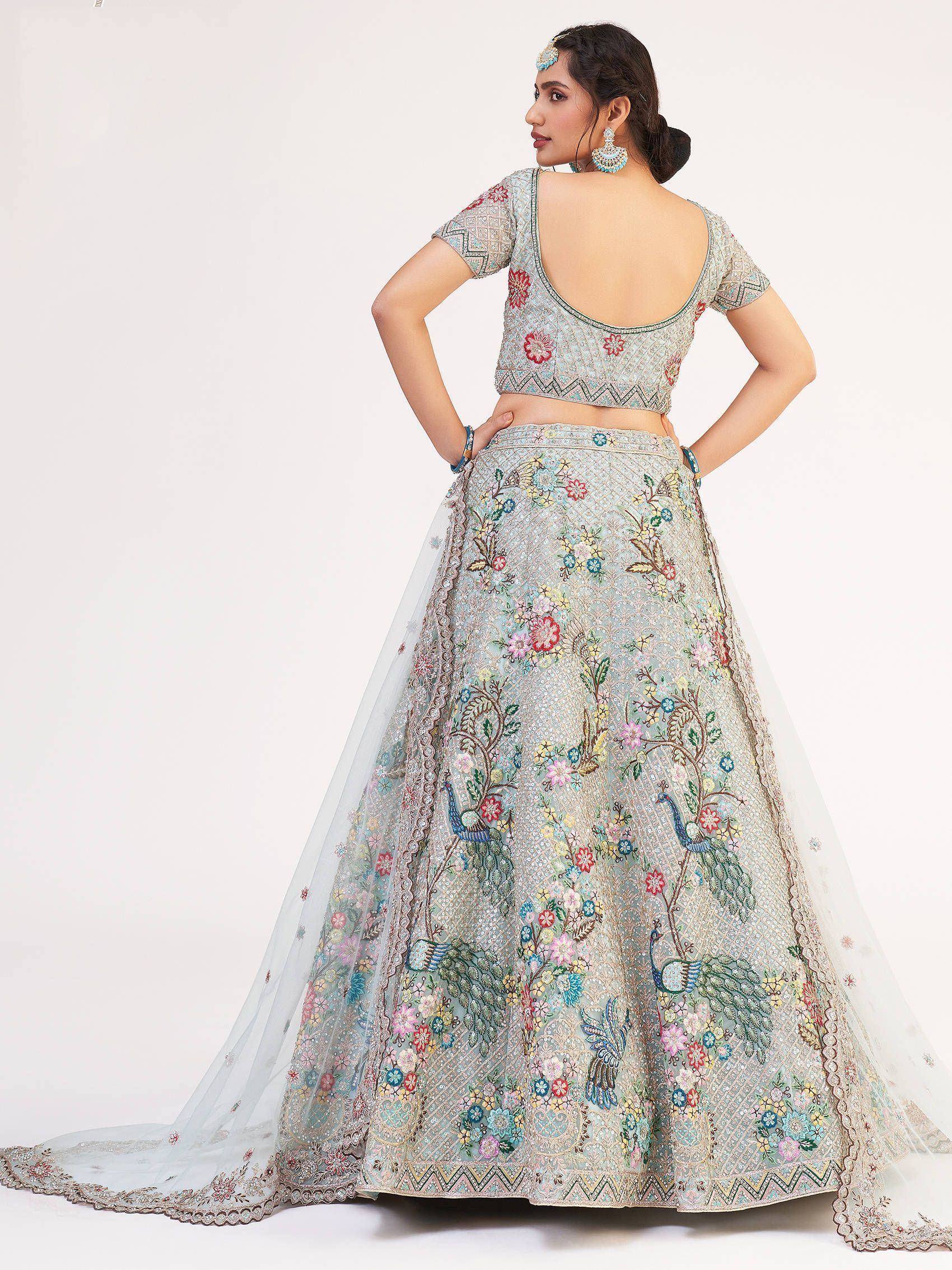 Designer lehenga choli with peacock and floral embroidery, perfect for Indian ethnic wear occasions.