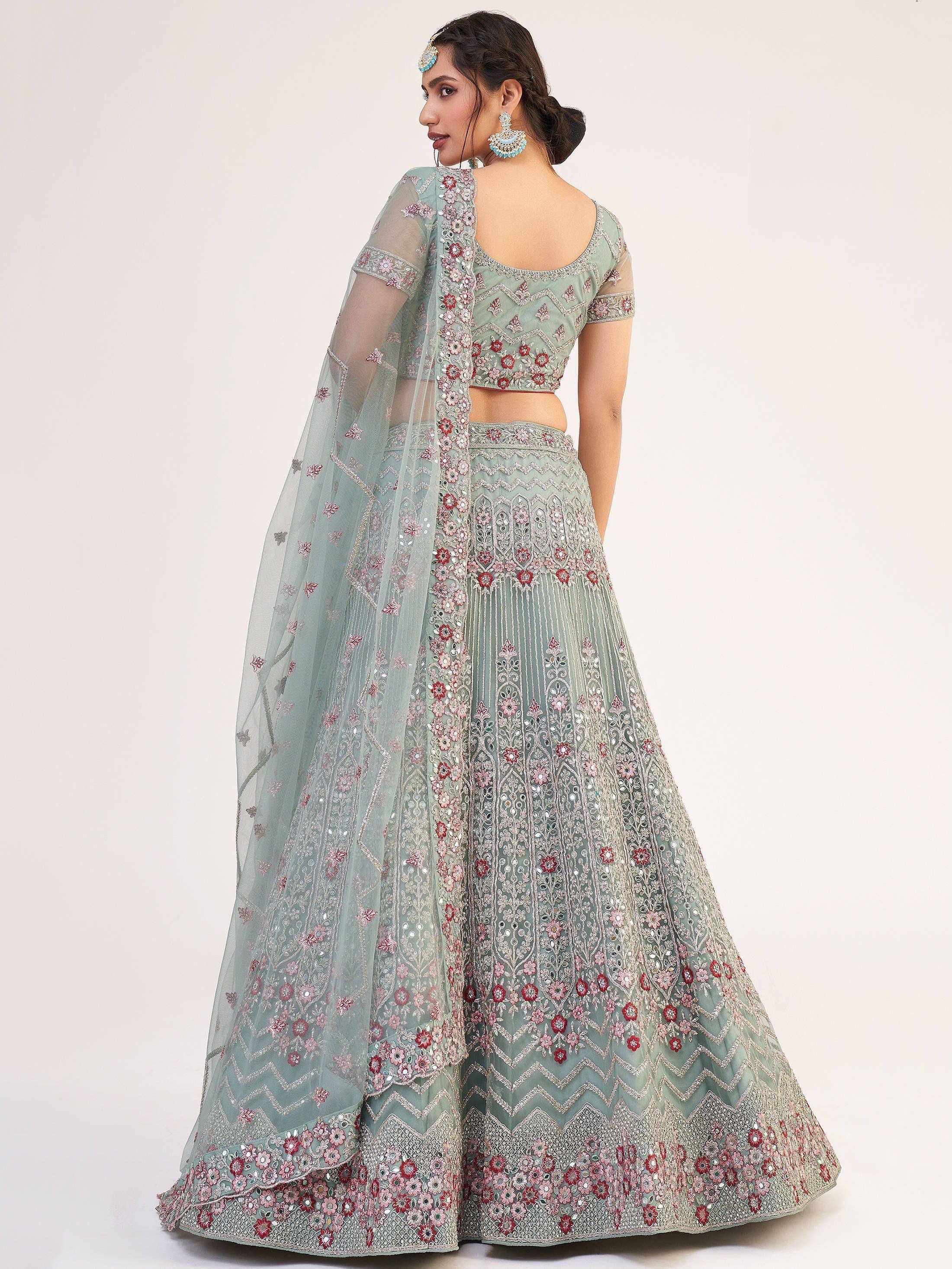 Mint green embroidered lehenga choli with floral motifs and sheer dupatta, perfect for Indian weddings or festive occasions.
