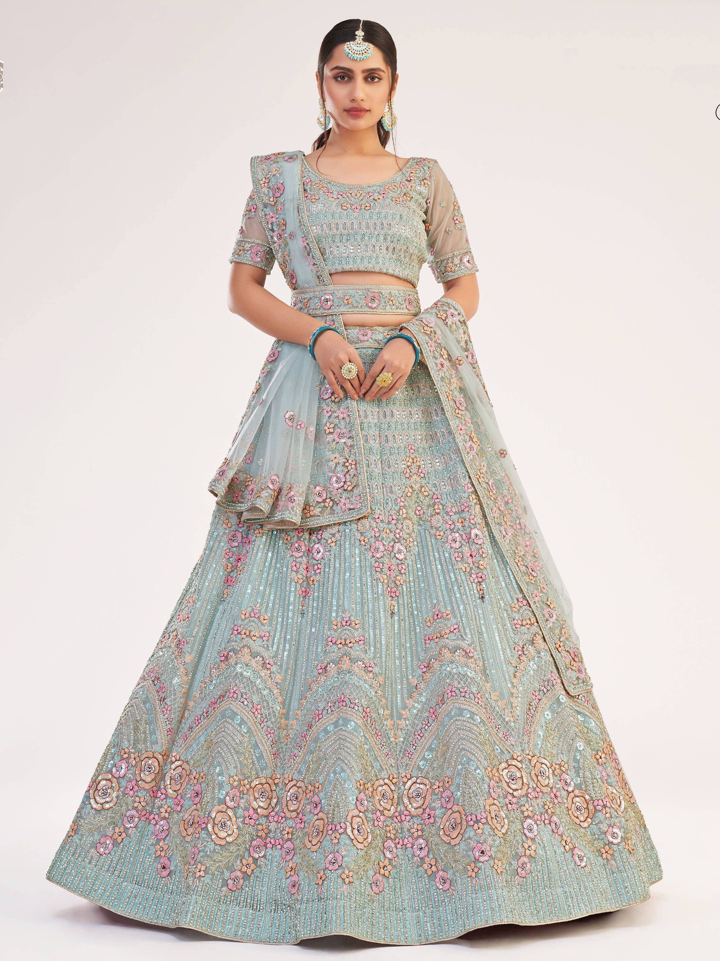 Light blue designer lehenga choli with pink floral embroidery and sheer dupatta for Indian weddings