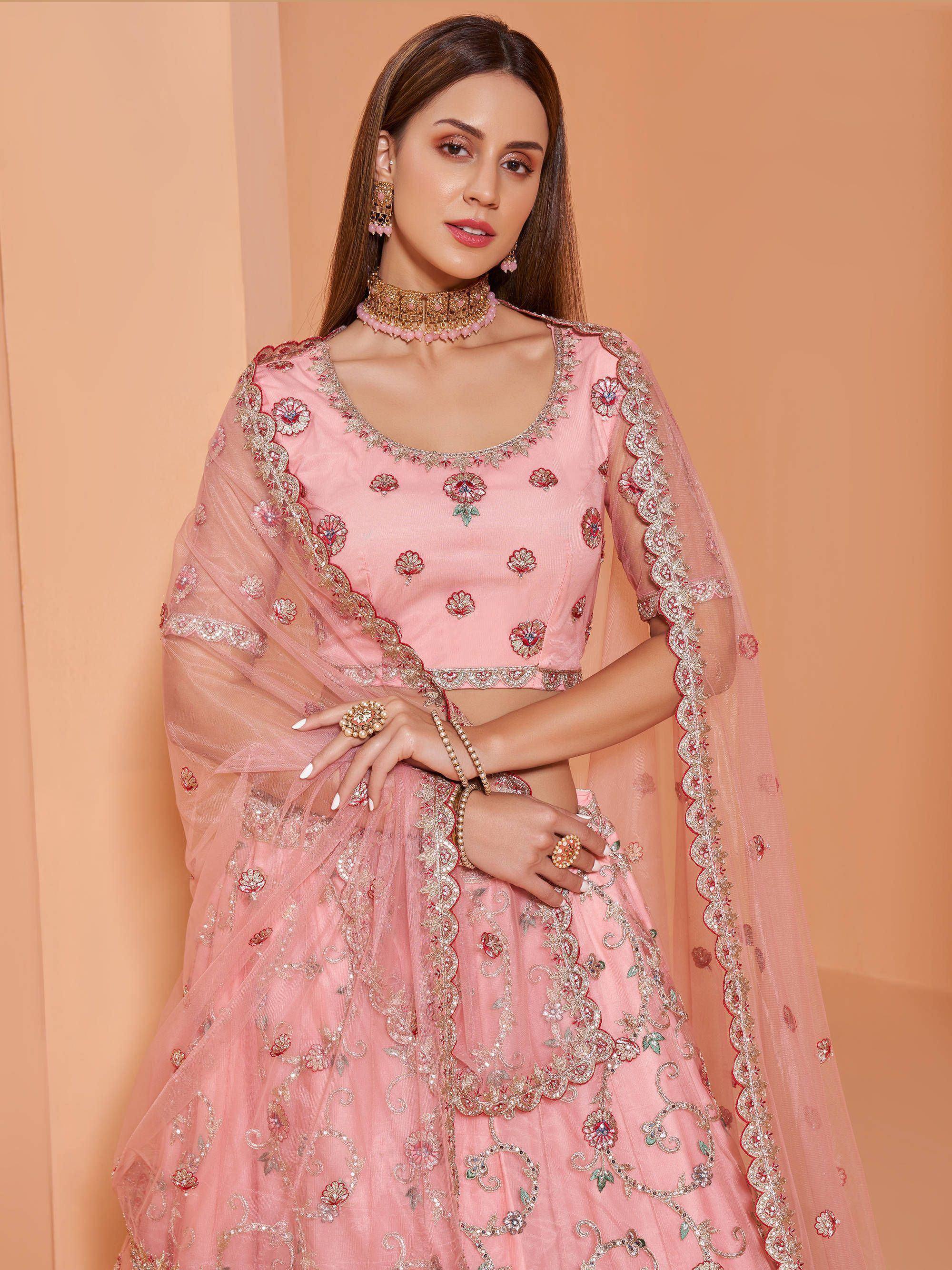 Pink embroidered lehenga choli with floral motifs and sheer dupatta, perfect for Indian ethnic wear occasions