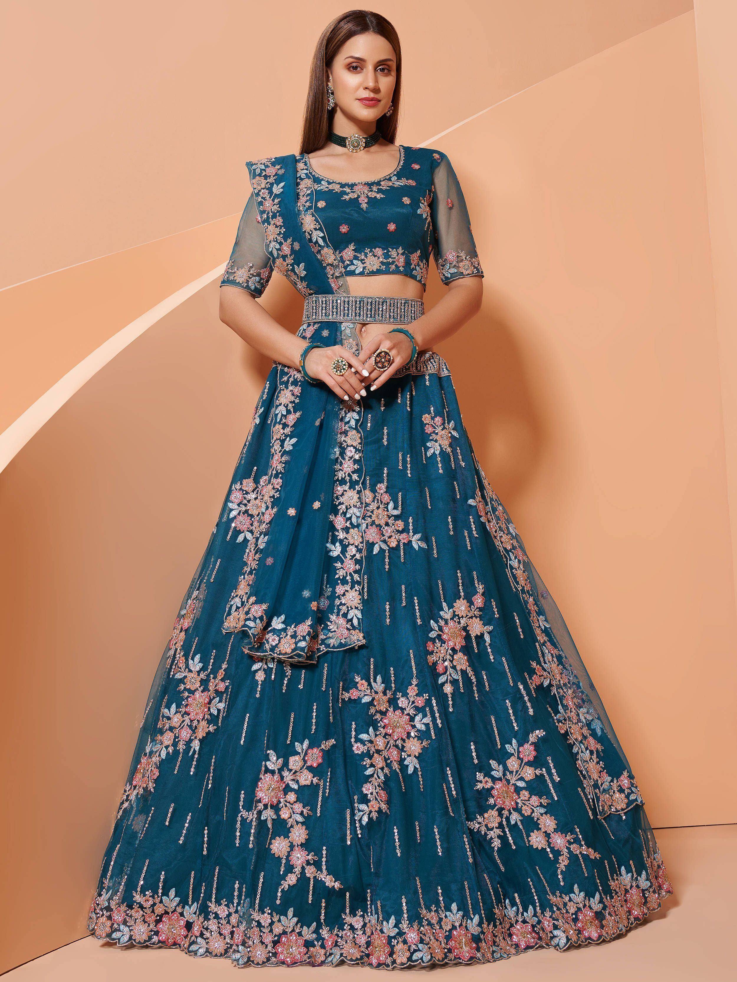 Teal floral embroidered lehenga choli with sheer sleeves, perfect for Indian weddings and festive occasions.