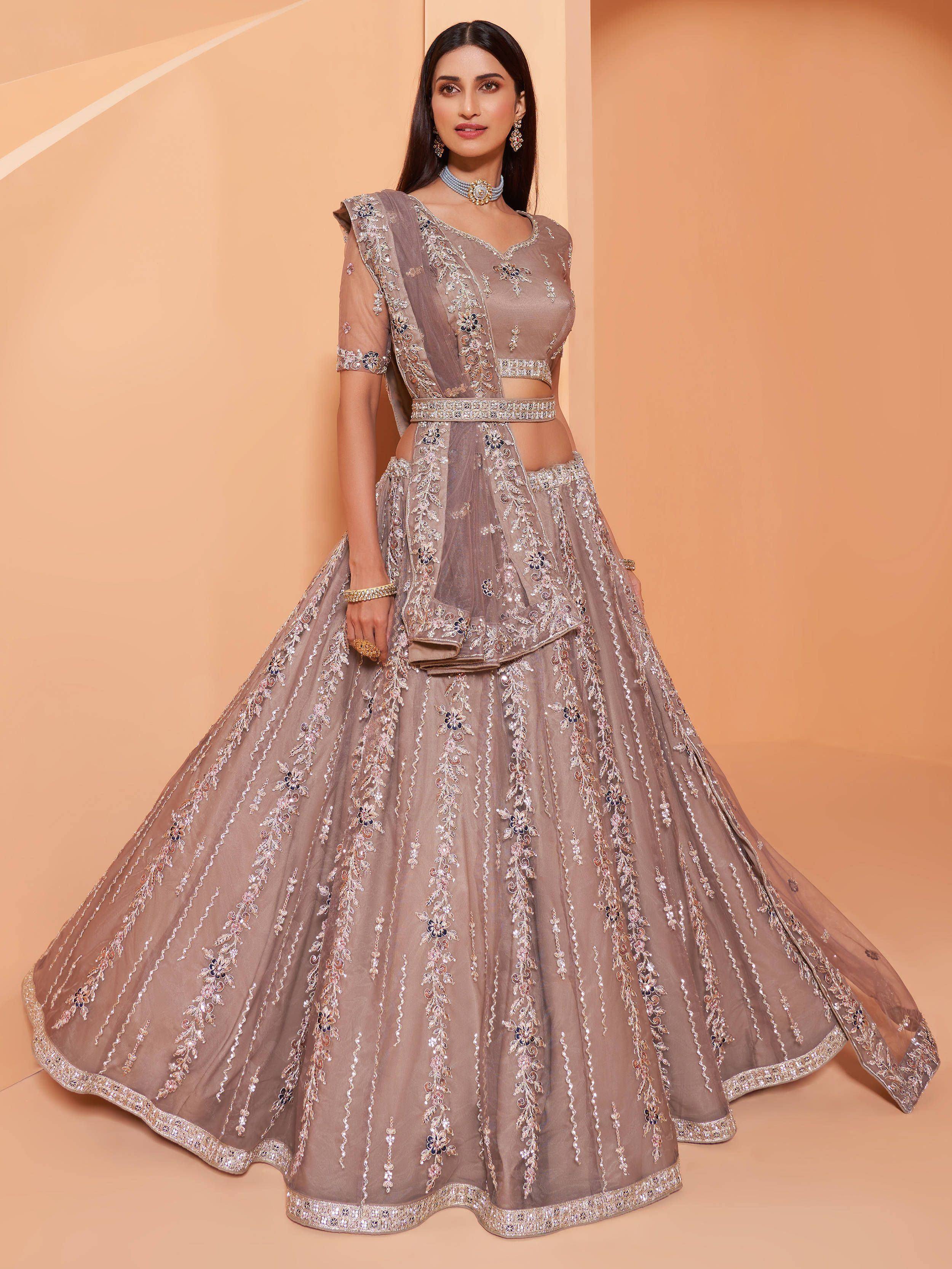 Elegant grey designer lehenga choli with intricate floral embroidery and sequin detailing for weddings