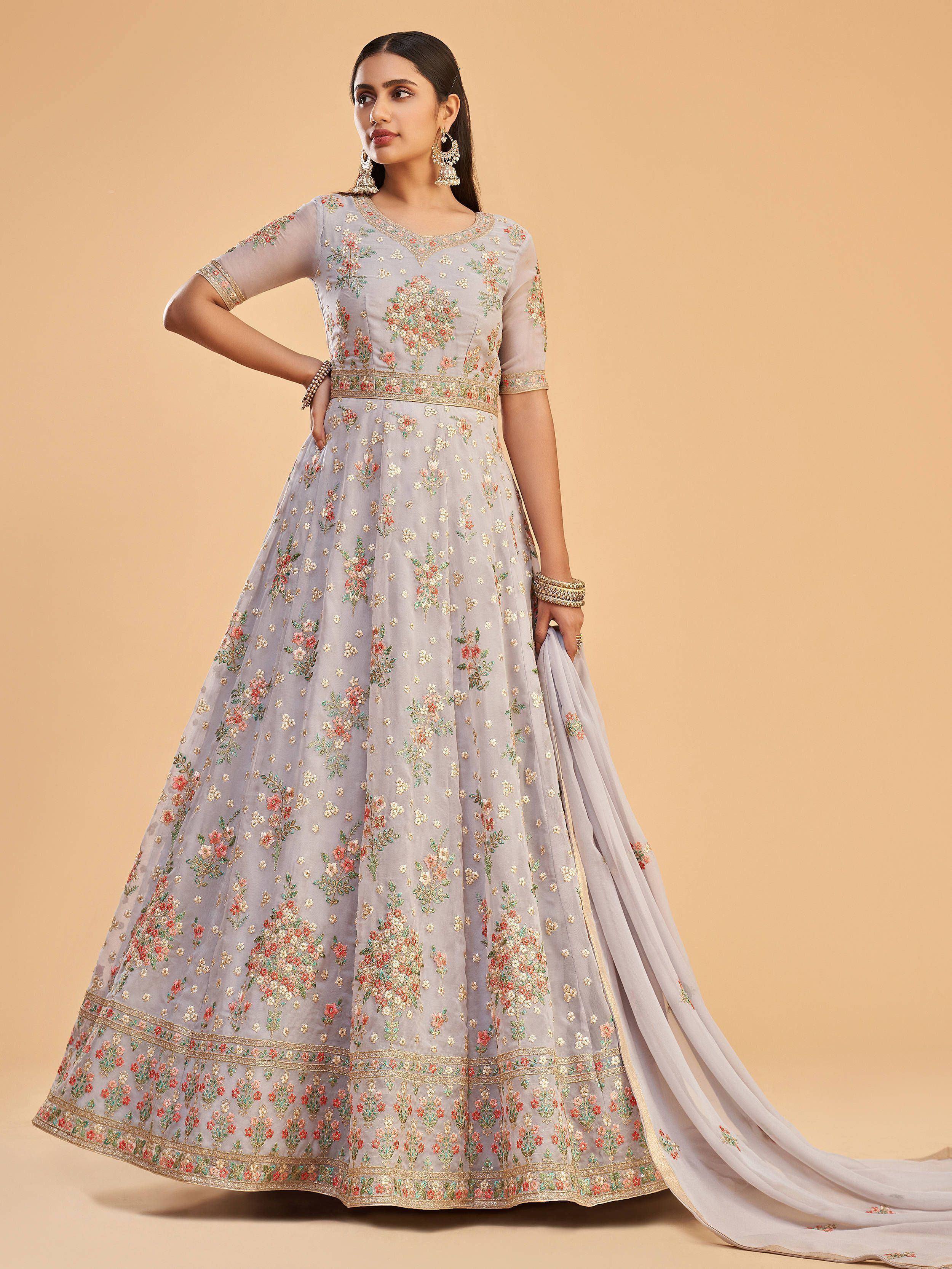Elegant grey floral embroidered lehenga choli with sheer sleeves and gold detailing, perfect for Indian ethnic occasions.