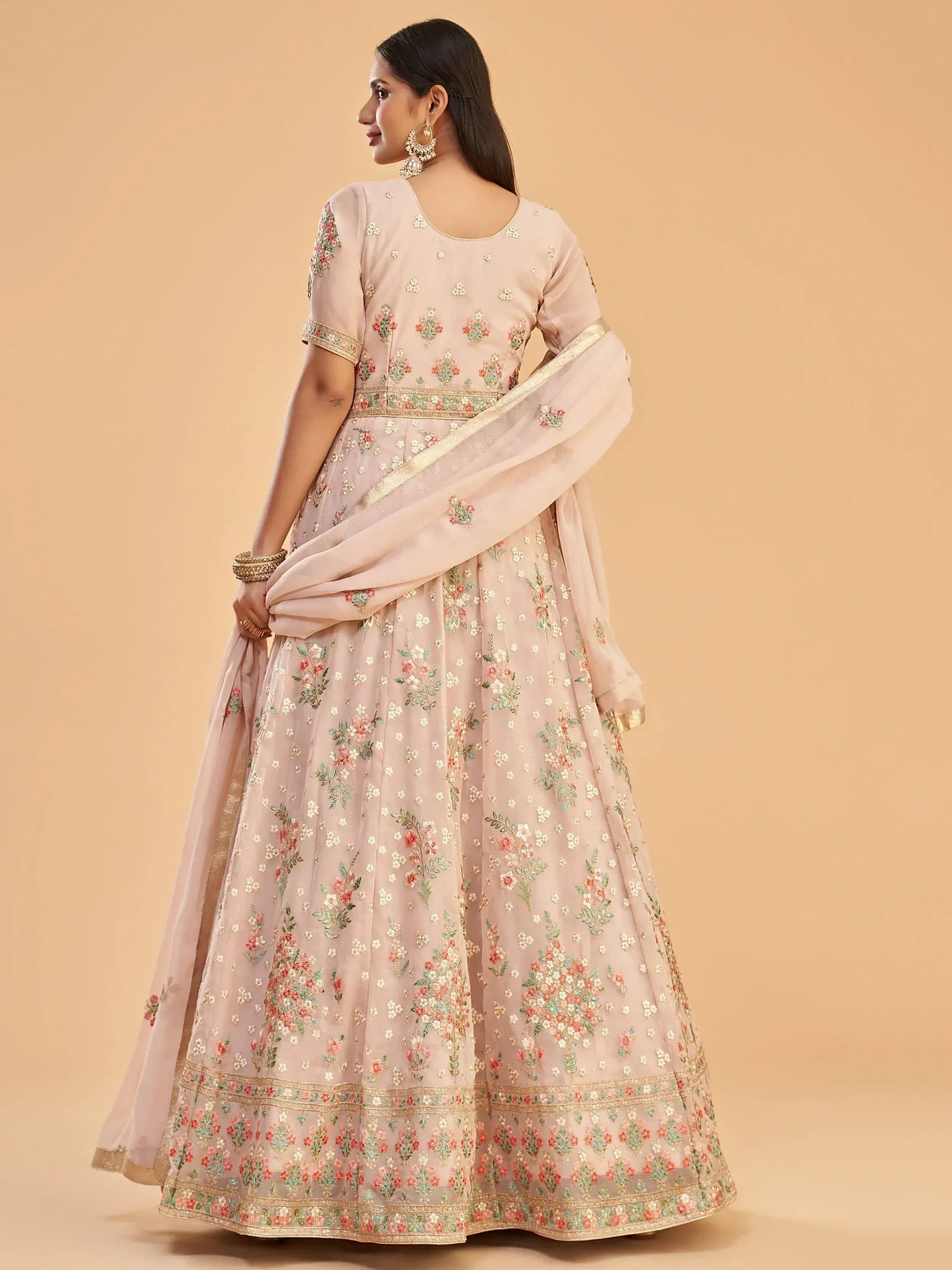 Elegant floral embroidered lehenga choli with golden accents, perfect for Indian ethnic wear.