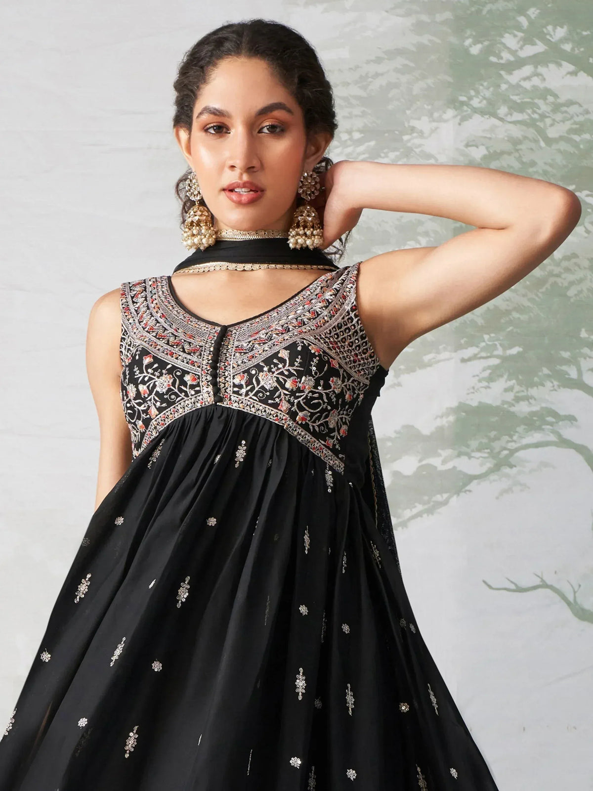 Black embroidered ethnic gown with floral detailing, perfect for Indian festive occasions and weddings.