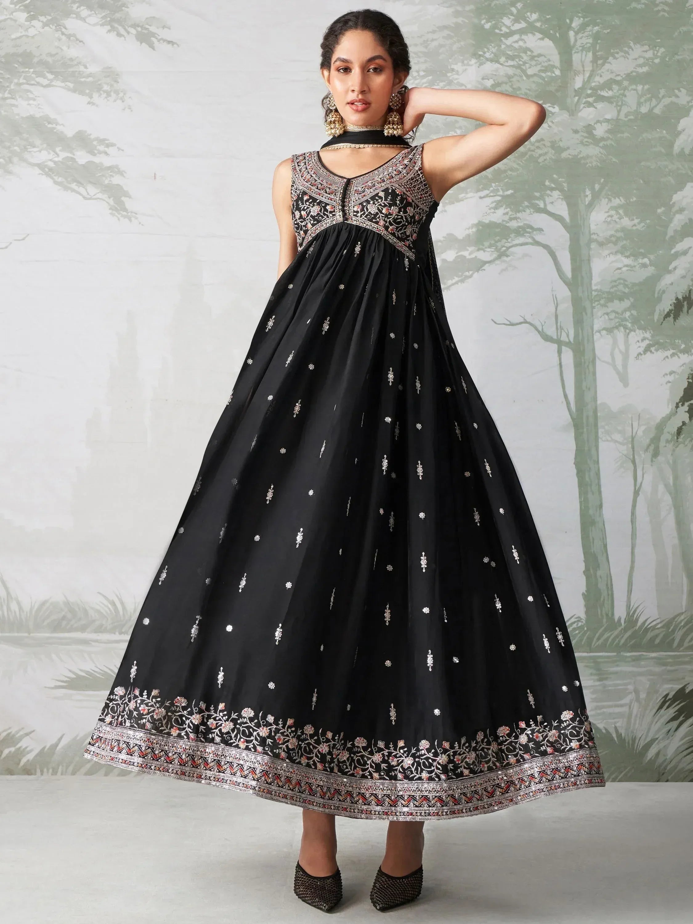 Black embroidered ethnic gown with floral detailing, perfect for Indian occasions and festive wear.