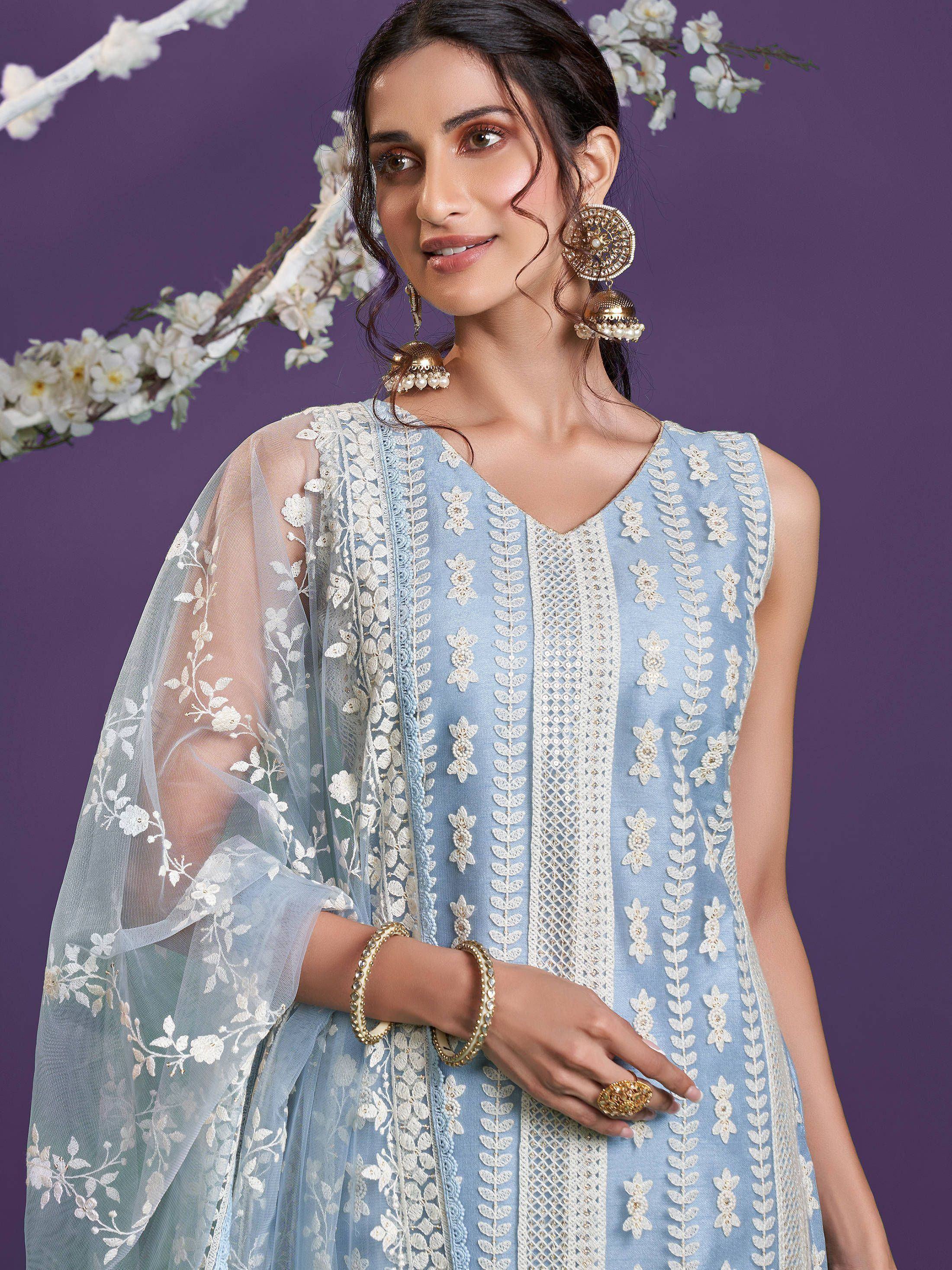 Light blue embroidered ethnic kurti with floral dupatta and gold jewelry