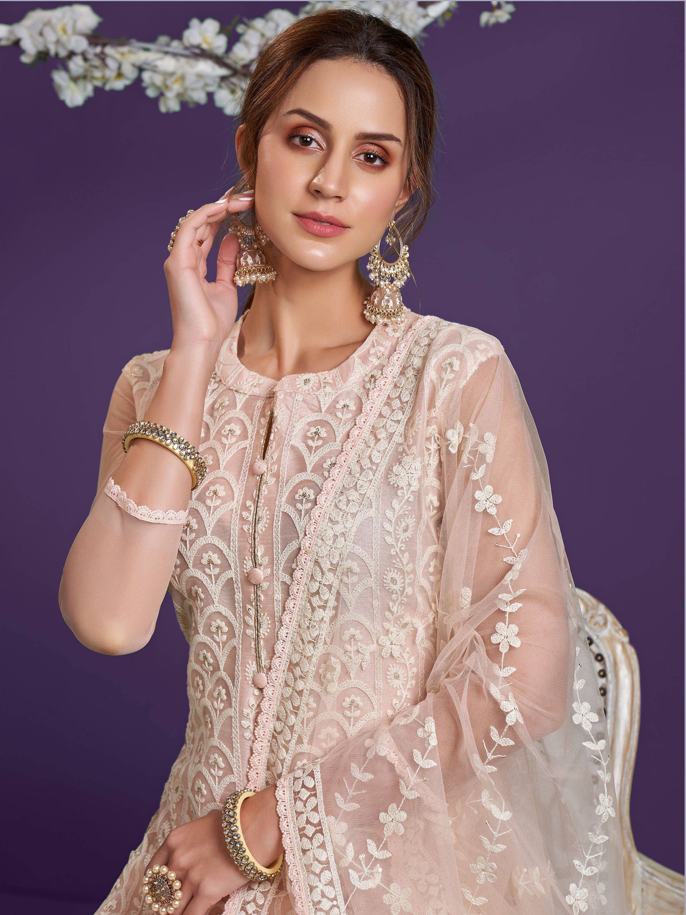 Elegant pink embroidered ethnic gown with floral lace and gold jewelry