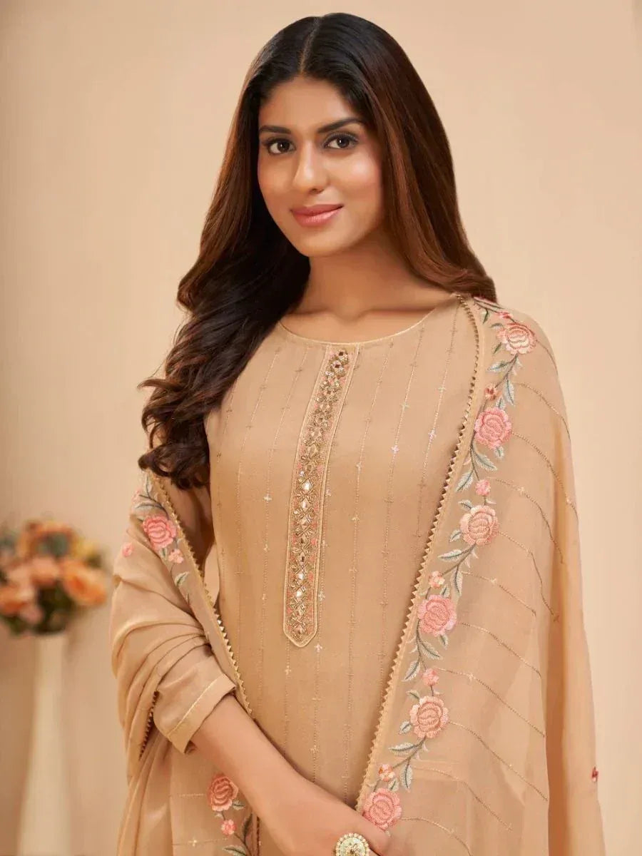 Beige embroidered salwar kameez with floral dupatta, perfect for ethnic occasions