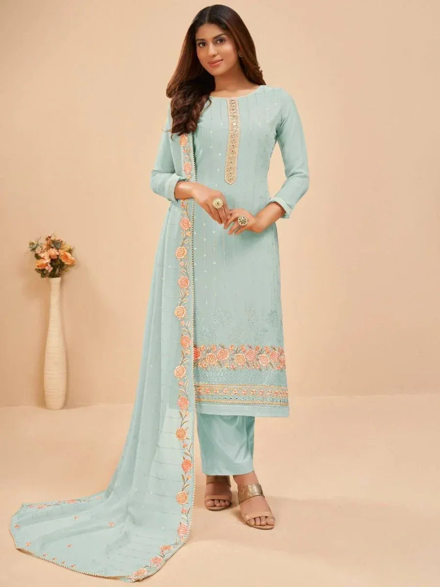 Woman in pastel blue embroidered salwar kameez with floral dupatta, ethnic wear fashion