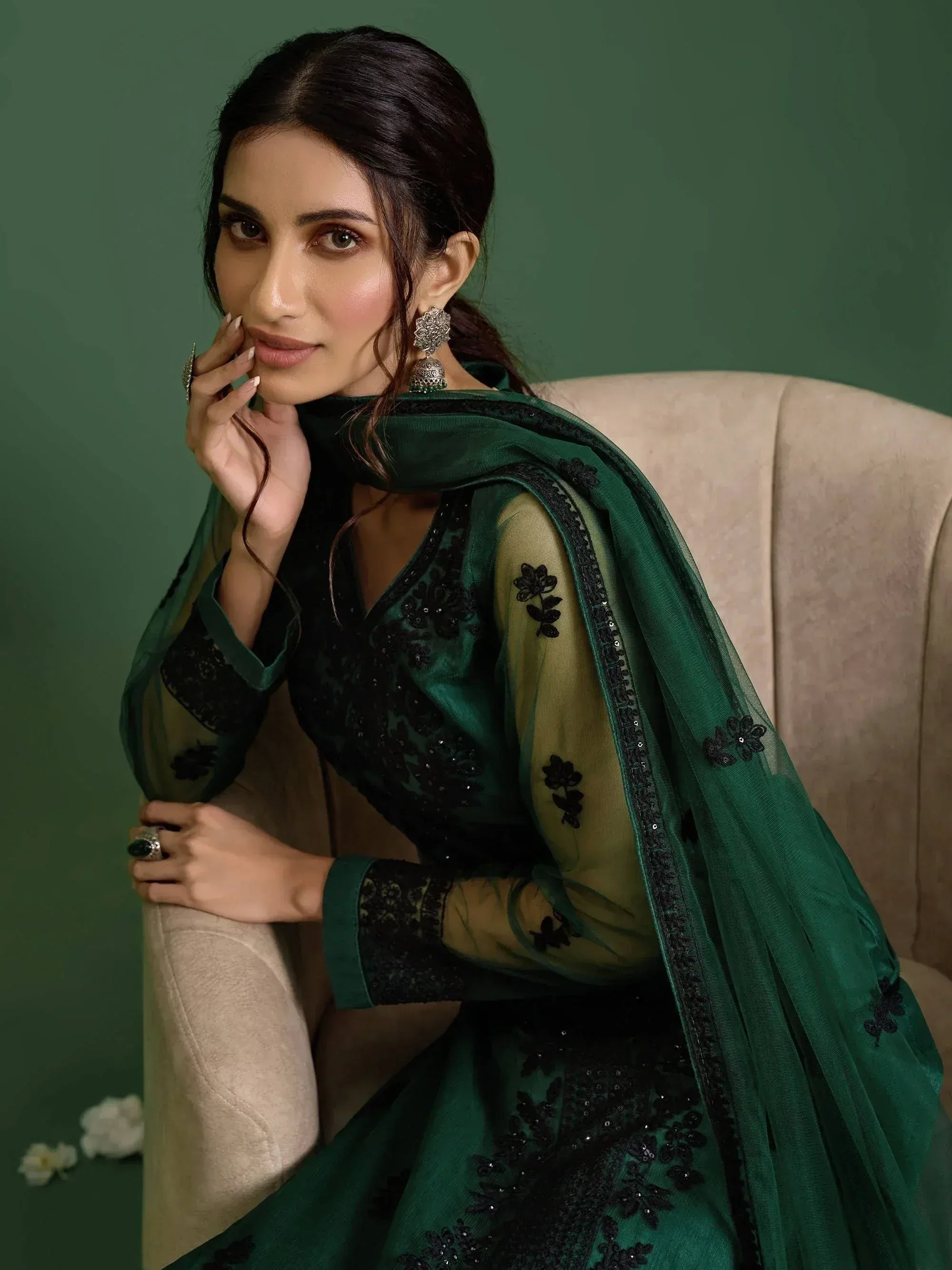 Elegant green ethnic gown with black floral embroidery, sheer sleeves, and matching dupatta for Indian wear