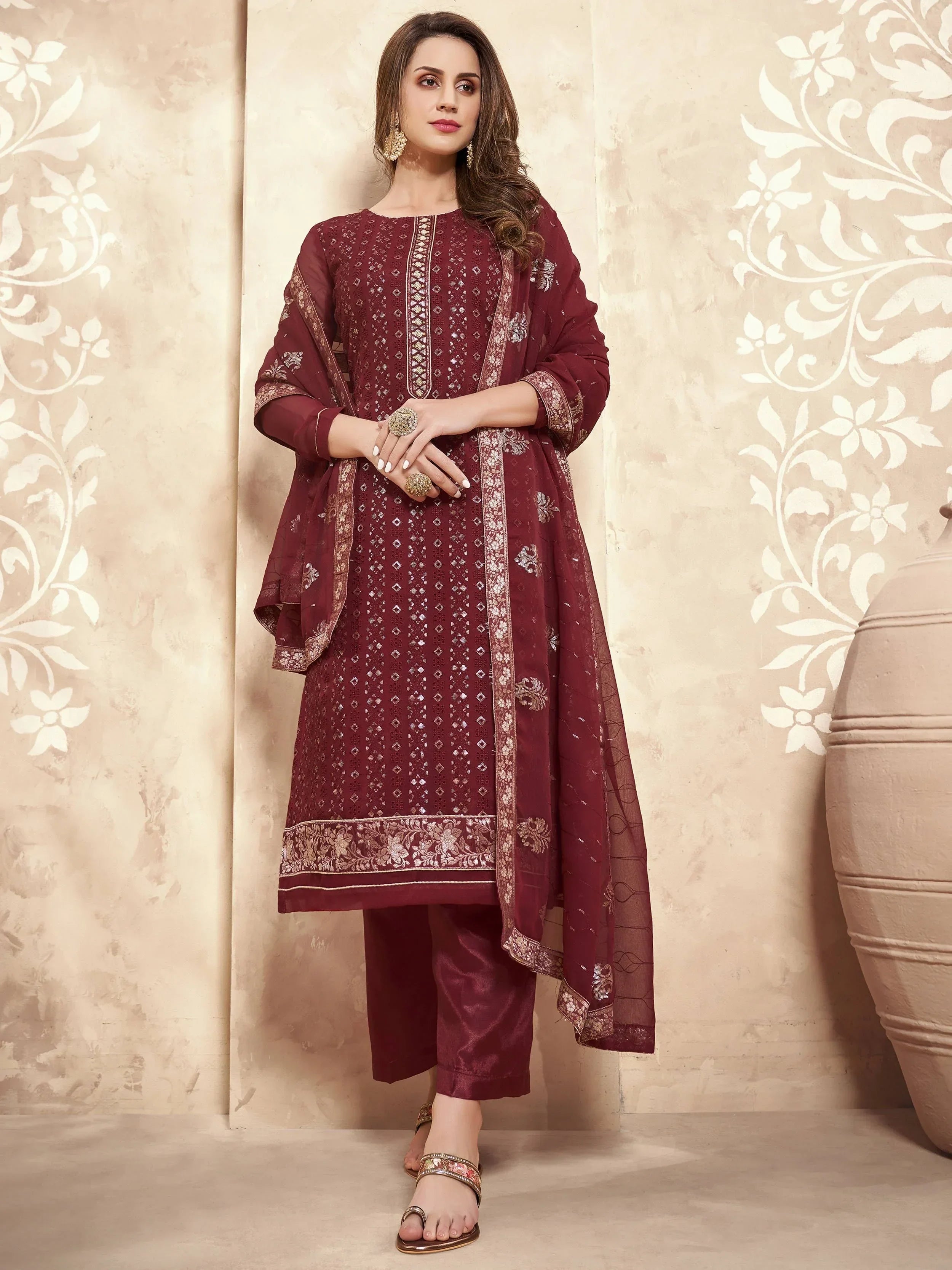 Woman wearing maroon embroidered straight-cut salwar kameez with matching dupatta