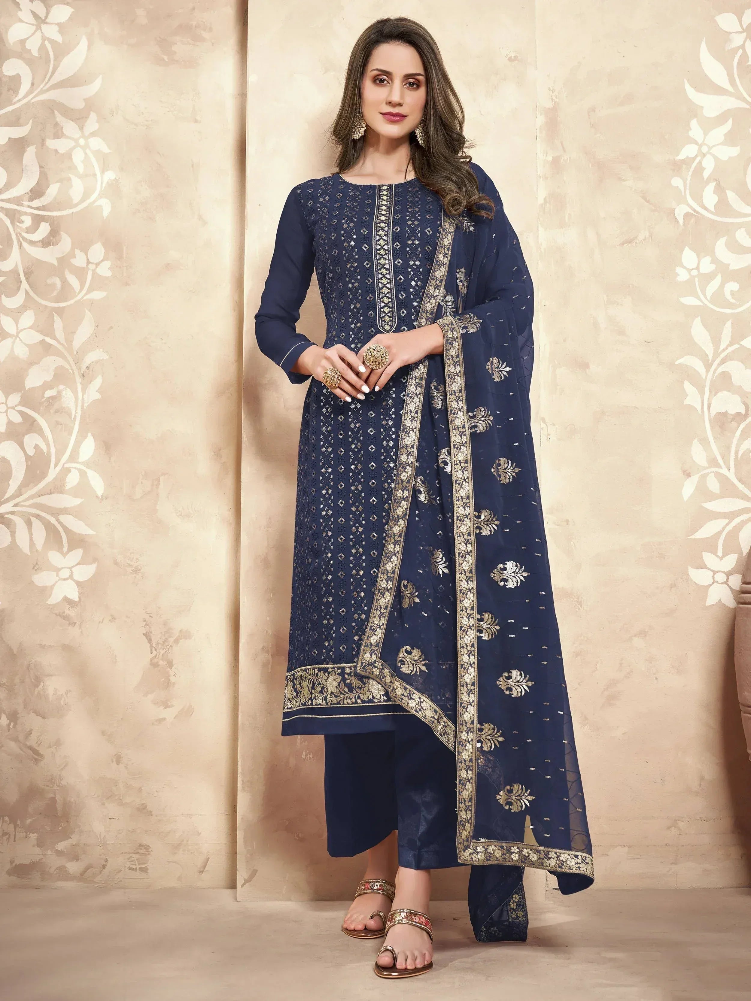 Navy blue embroidered salwar kameez with gold detailing, perfect for festive occasions and ethnic wear.