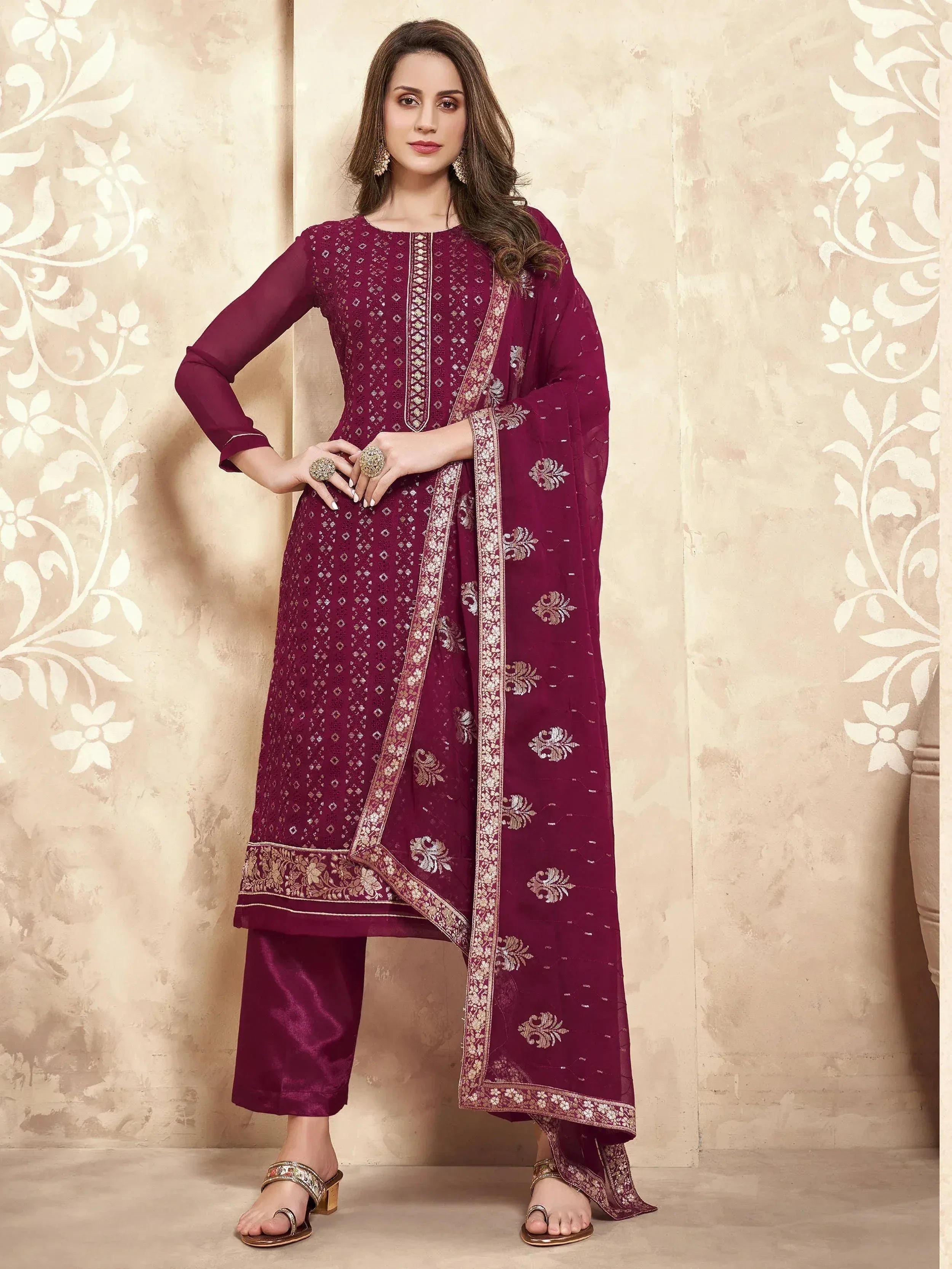 Elegant maroon salwar kameez with gold embroidery and matching dupatta, perfect for ethnic occasions.