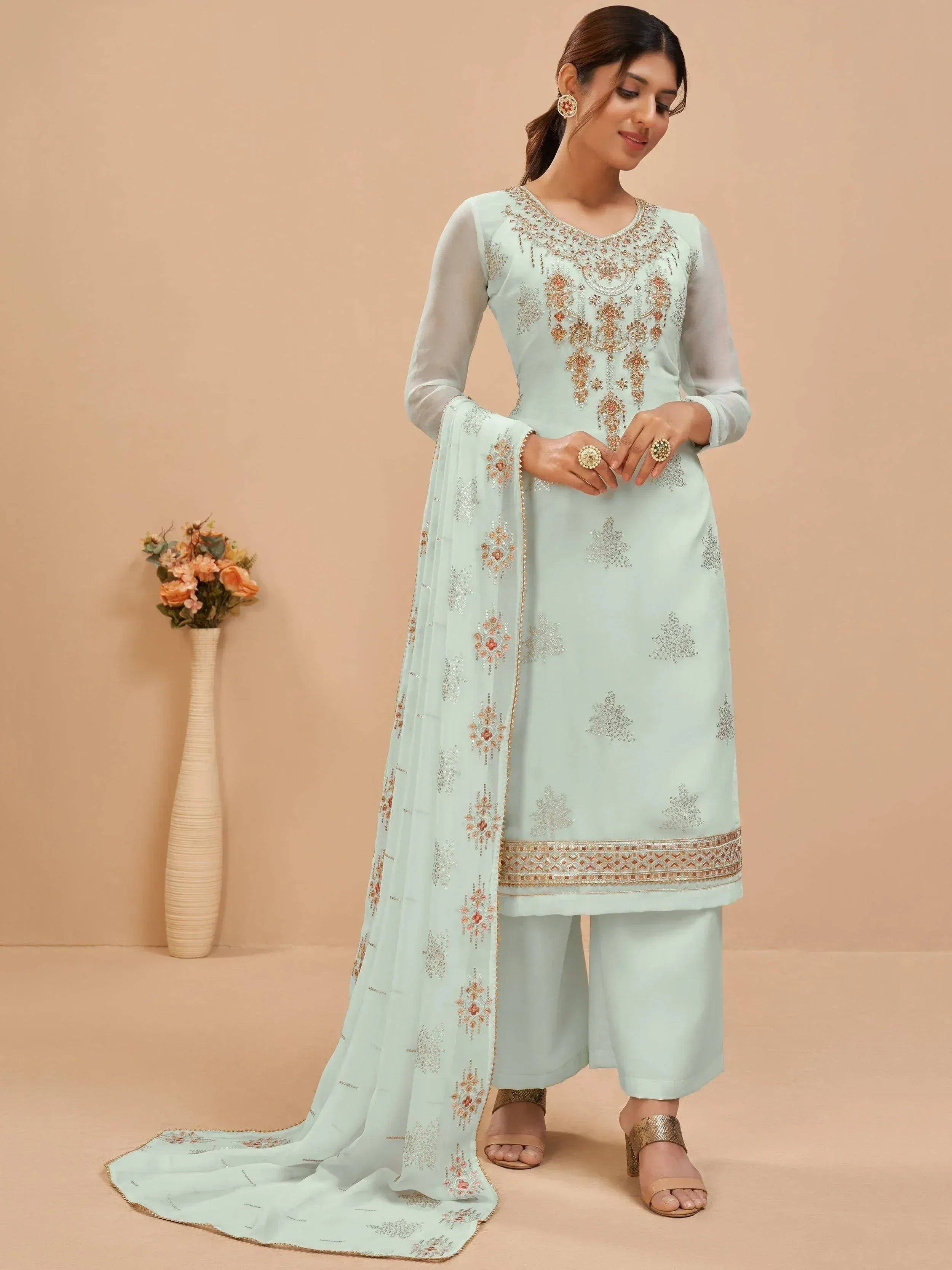 Mint green embroidered salwar kameez with sheer sleeves and matching dupatta, ideal for Indian ethnic wear.