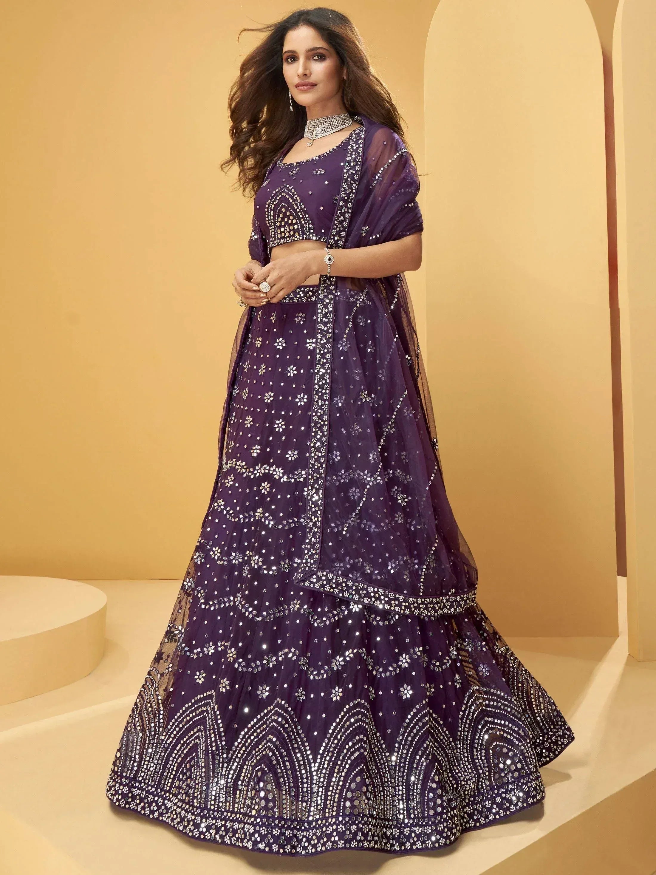 Purple designer lehenga choli with mirror work and sequins, perfect for Indian ethnic wear occasions
