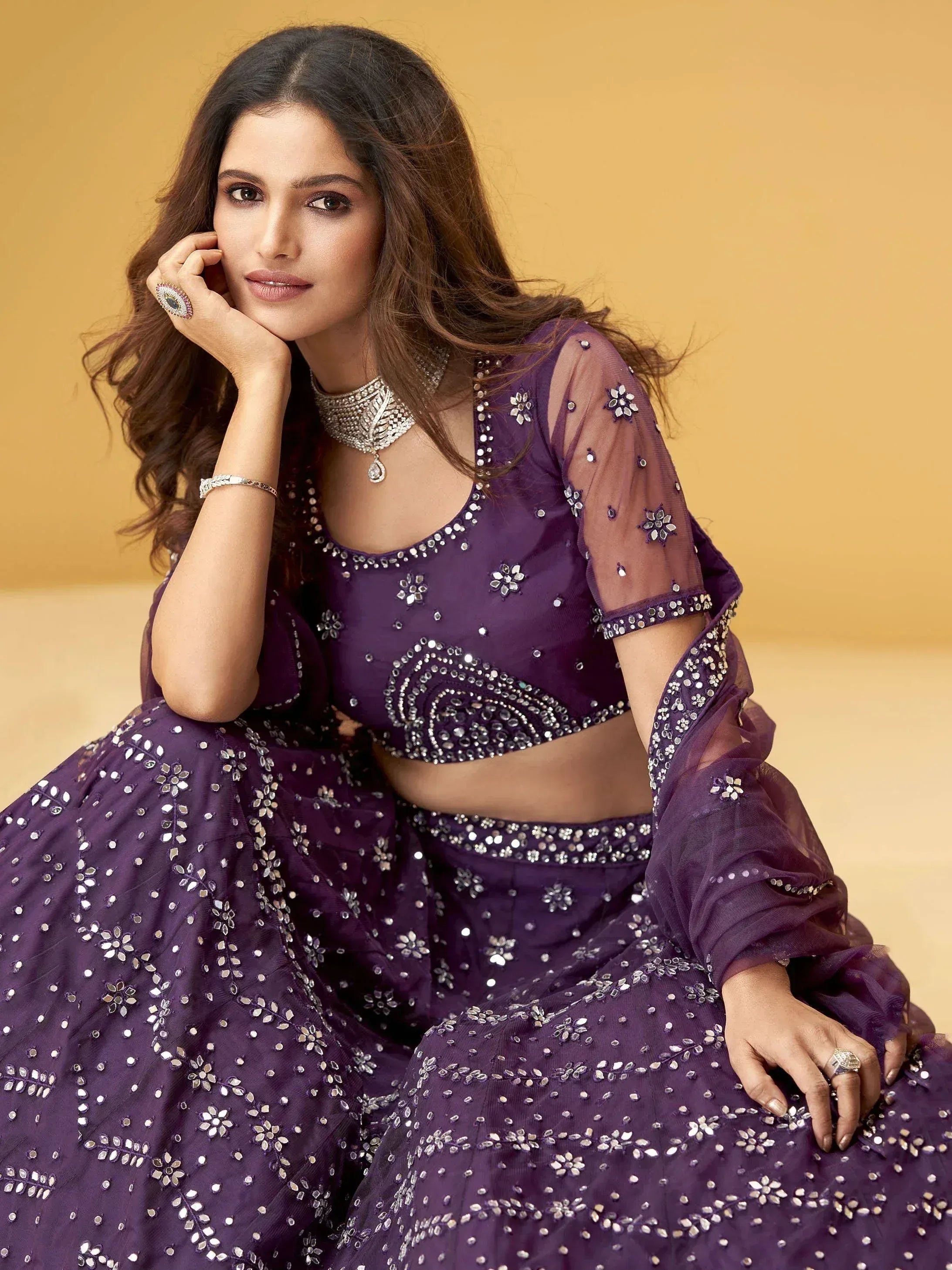 Purple designer lehenga choli with floral mirror work, perfect for Indian ethnic wear events