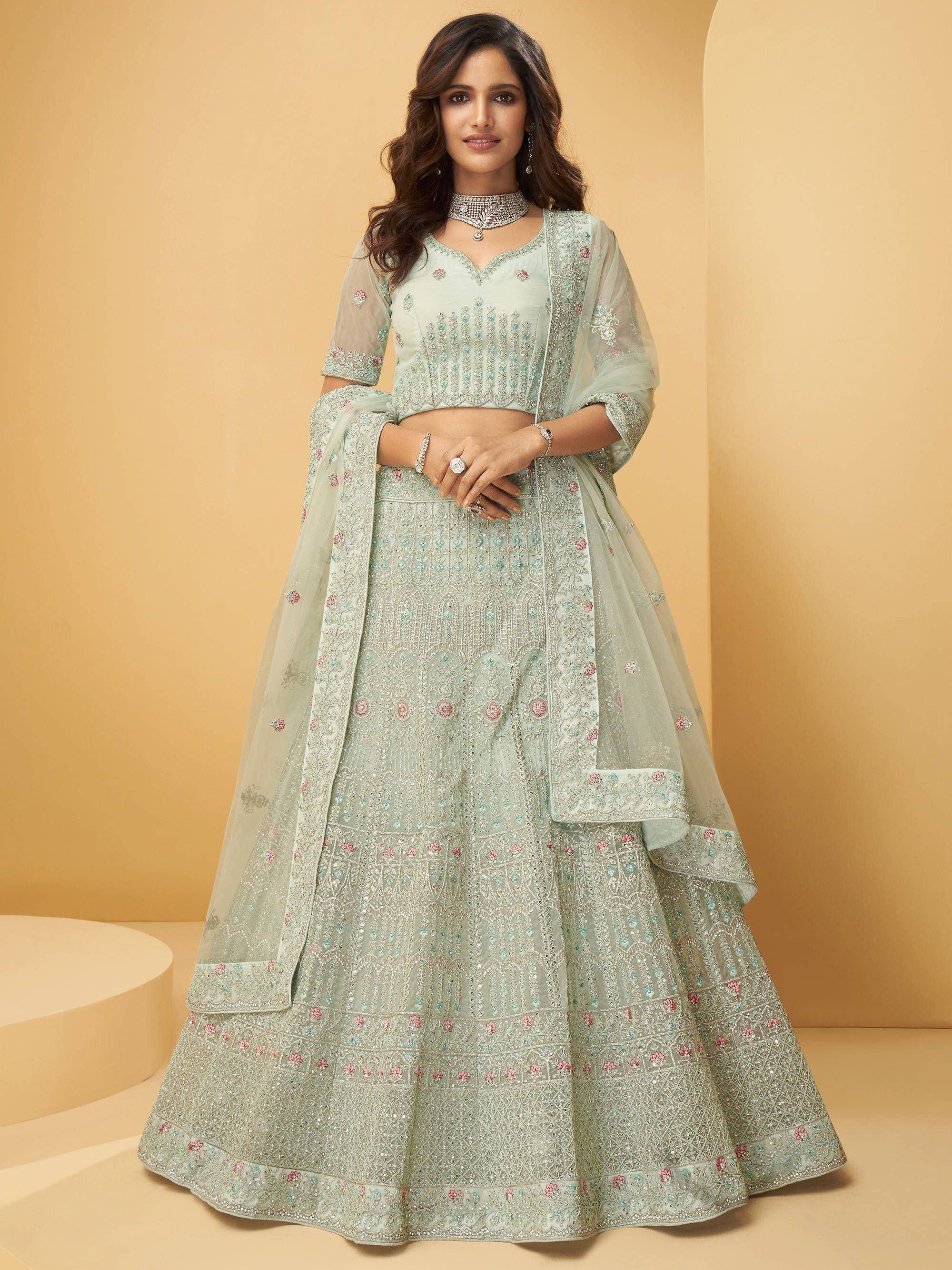 Mint green embroidered lehenga choli with floral motifs and sheer dupatta, perfect for Indian weddings and festive occasions.